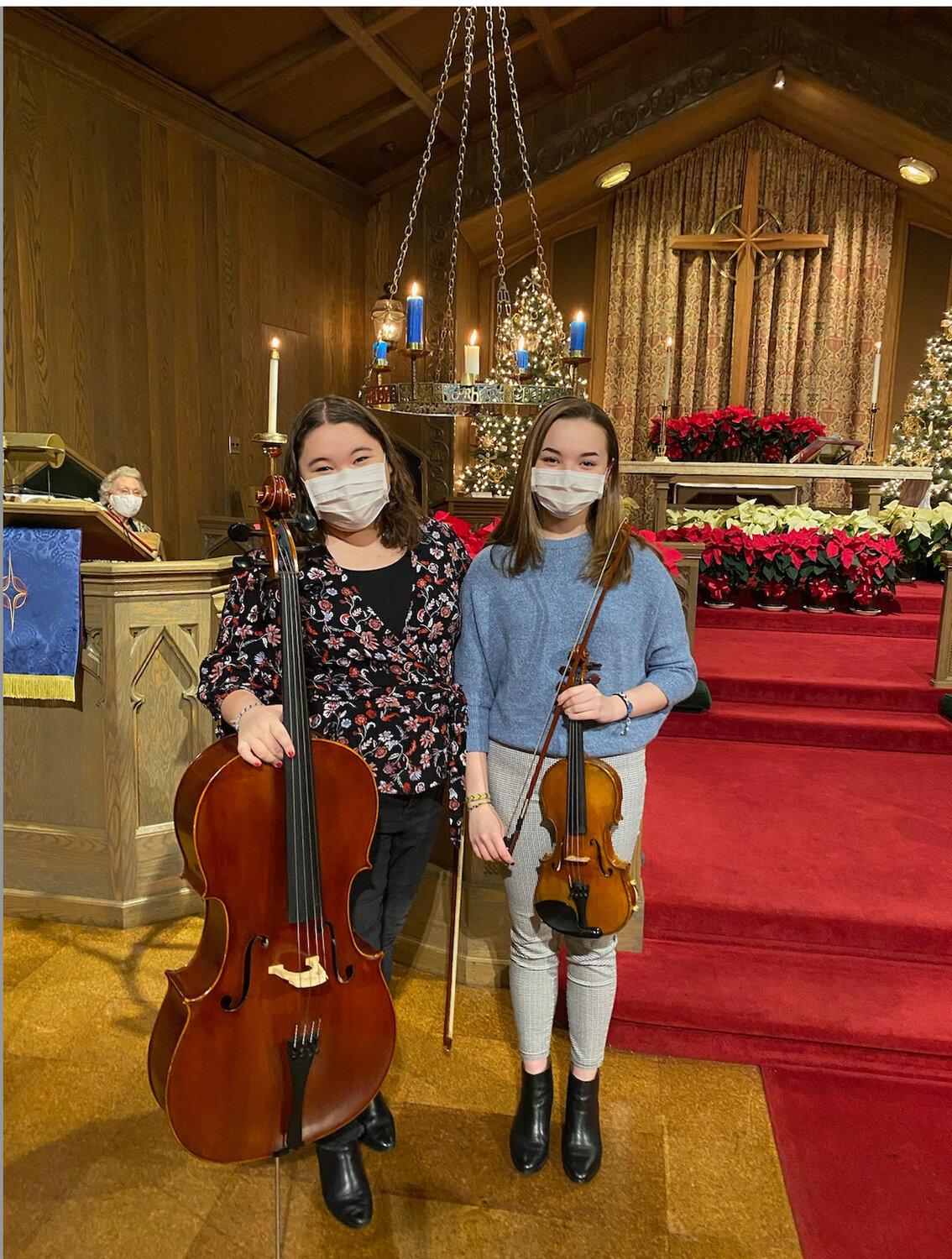 Kayla and Emma Sorensen performed Christmas songs for Our Saviour’s Lutheran Church. The musicians wore their masks inside to follow state-mandated social distancing guidelines.