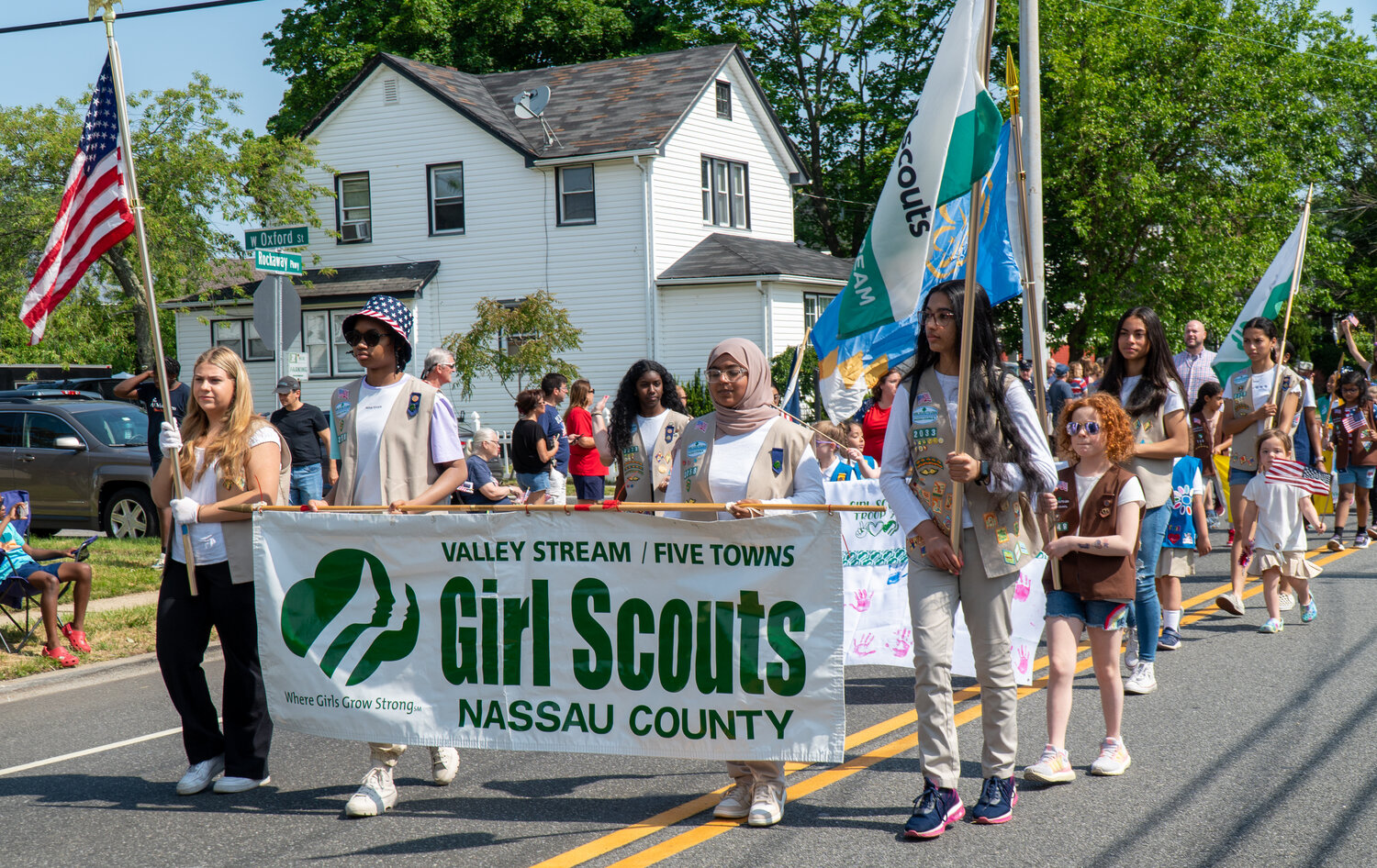 The Nassau County Girl Scouts honored fallen soldiers at the village’s annual Memorial Day parade on May 29.