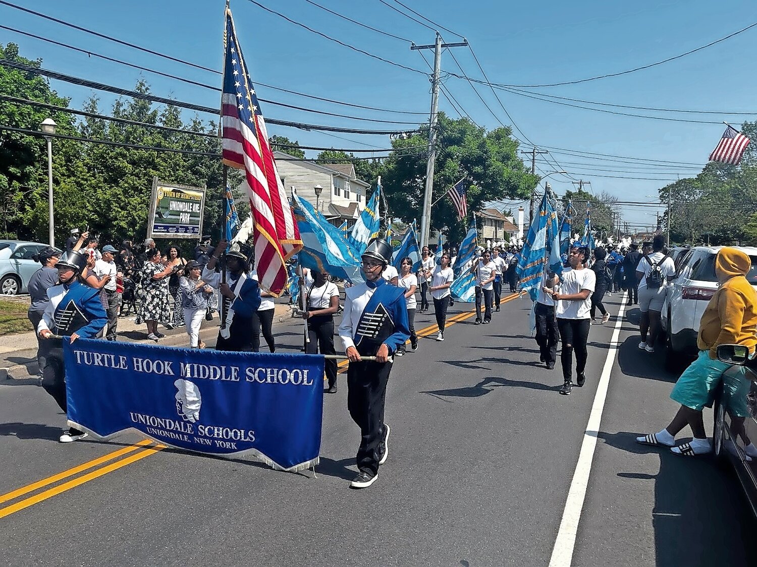 The Turtle Hook Middle School marching band moved along Uniondale Avenue.
