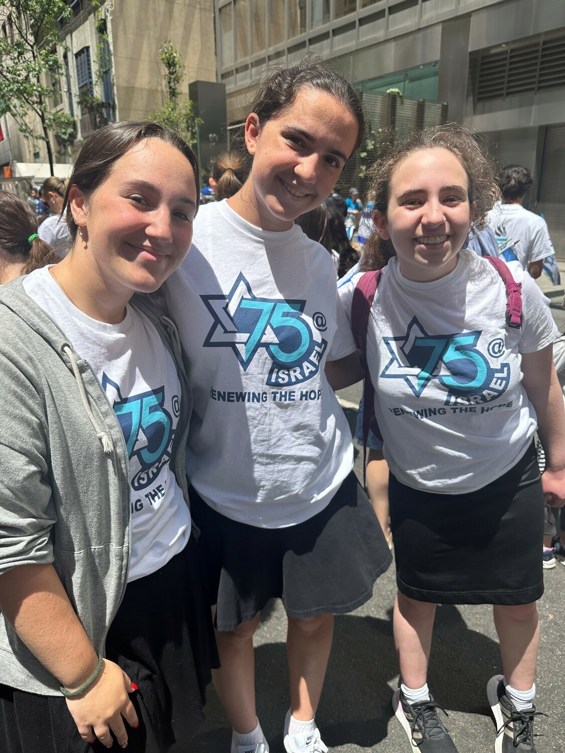 Brandeis Hebrew Academy students Payge Lederman, left, Jacqueline Thayer and Ilana Greenberg at Israel parade on June 4.