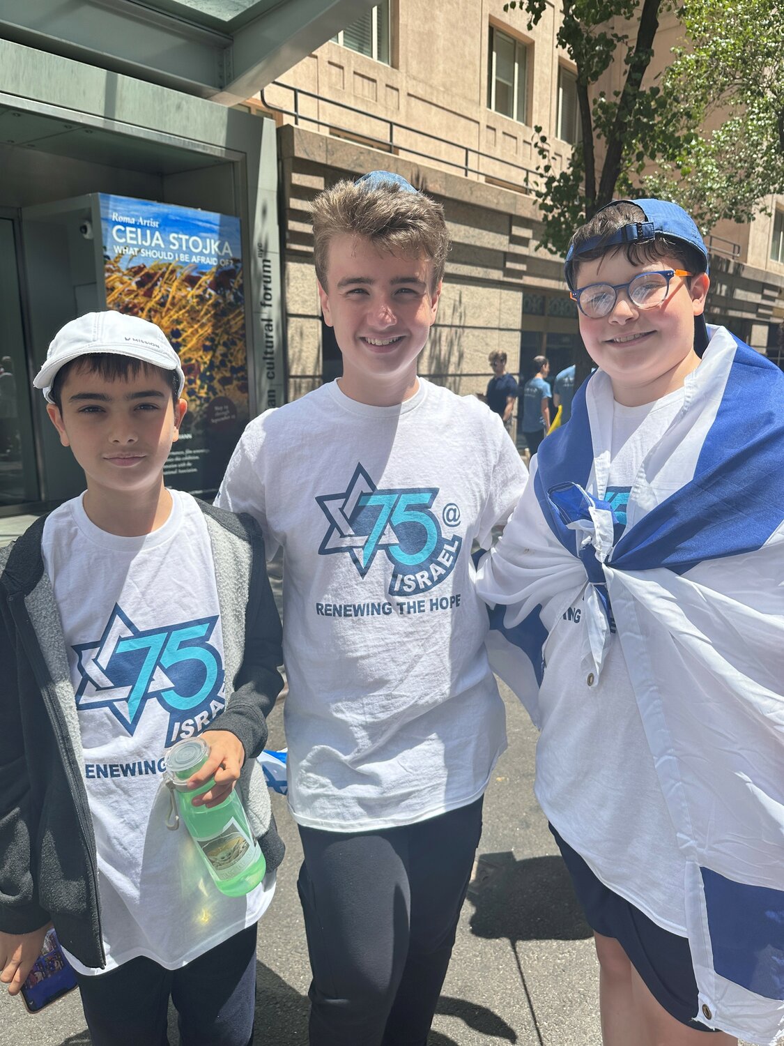 At the Israel parade on June 4 were Brandeis Hebrew Academy students Ilan Rakhminov, left, Avishai Greenberg and Adam Mandelbaum.