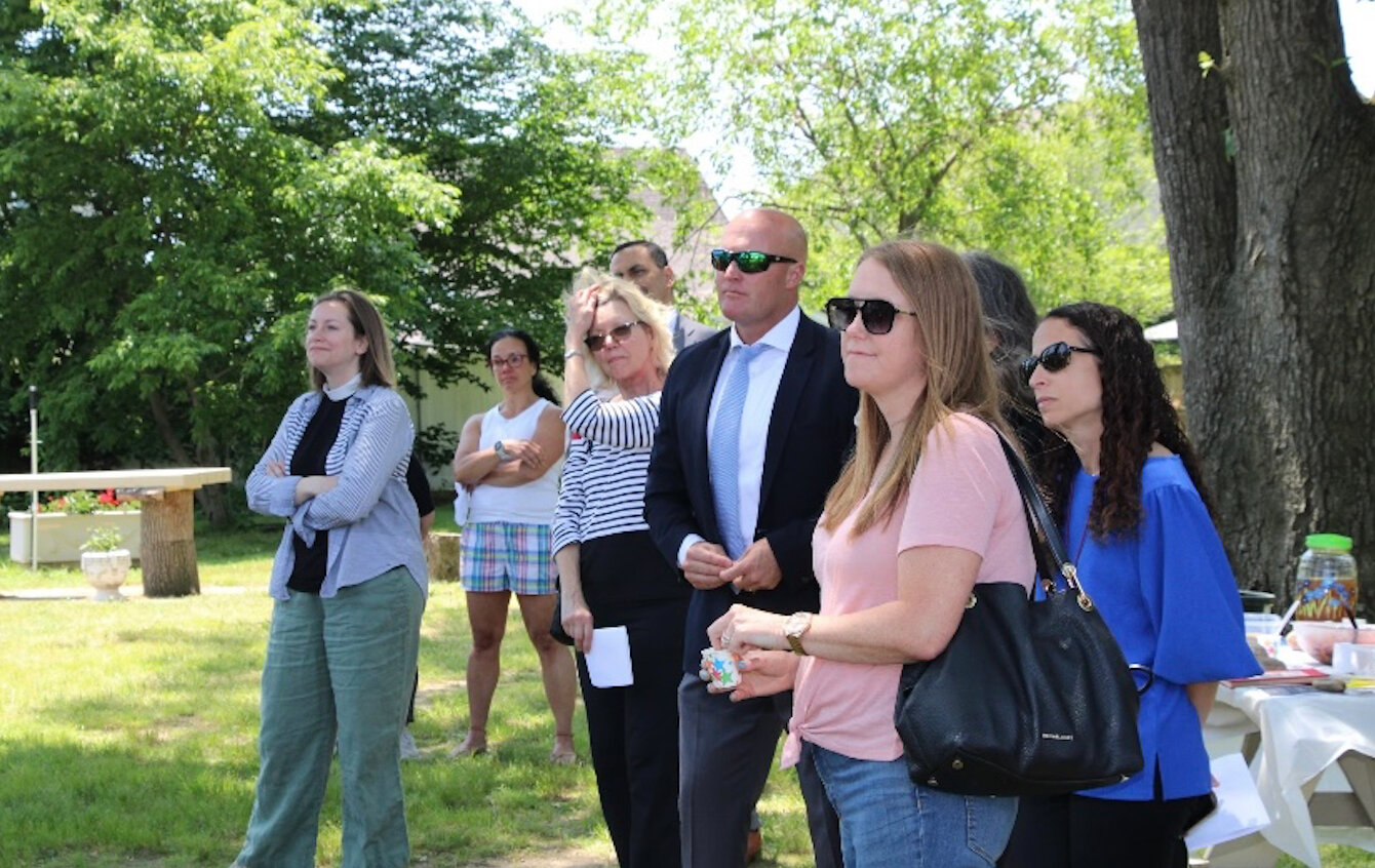 Yepez’s presentation was attended by teachers and school officials, including Bellmore-Merrick Superintendent Mike Harrington, center. Yepez used her internship to establish a connection between the school district and the garden.