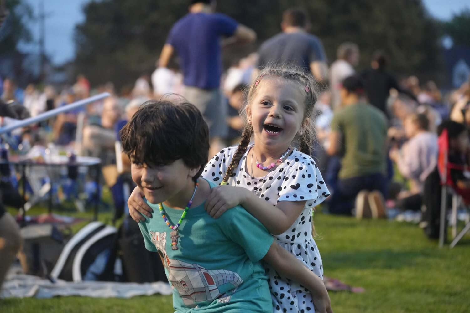 Playful siblings Charlie, 5, and Sadie McMenamin, 4, of Rockville Centre, enjoy the festivities.