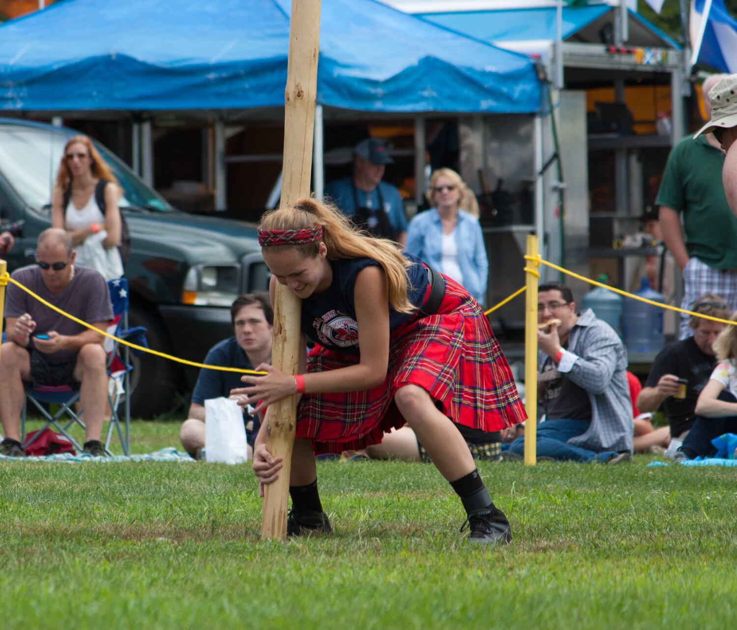 A competitor prepares to toss the caber.