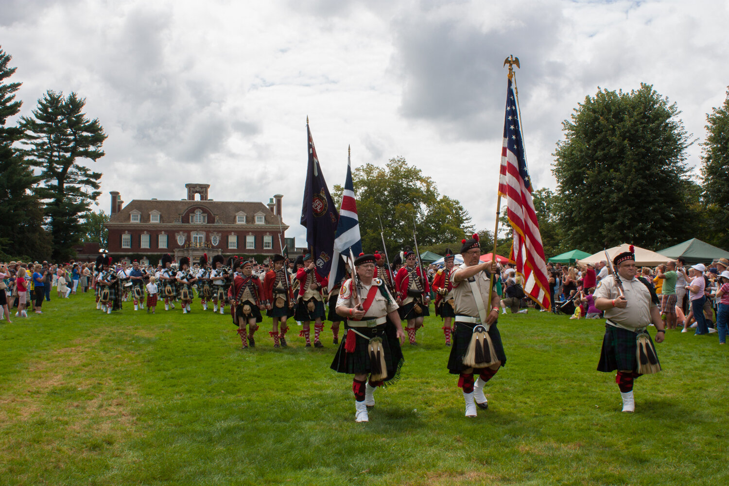 Colorful pipers and drummers prepare to step proudly around the grounds of Old Westbury Gardens honoring a cherished heritage.