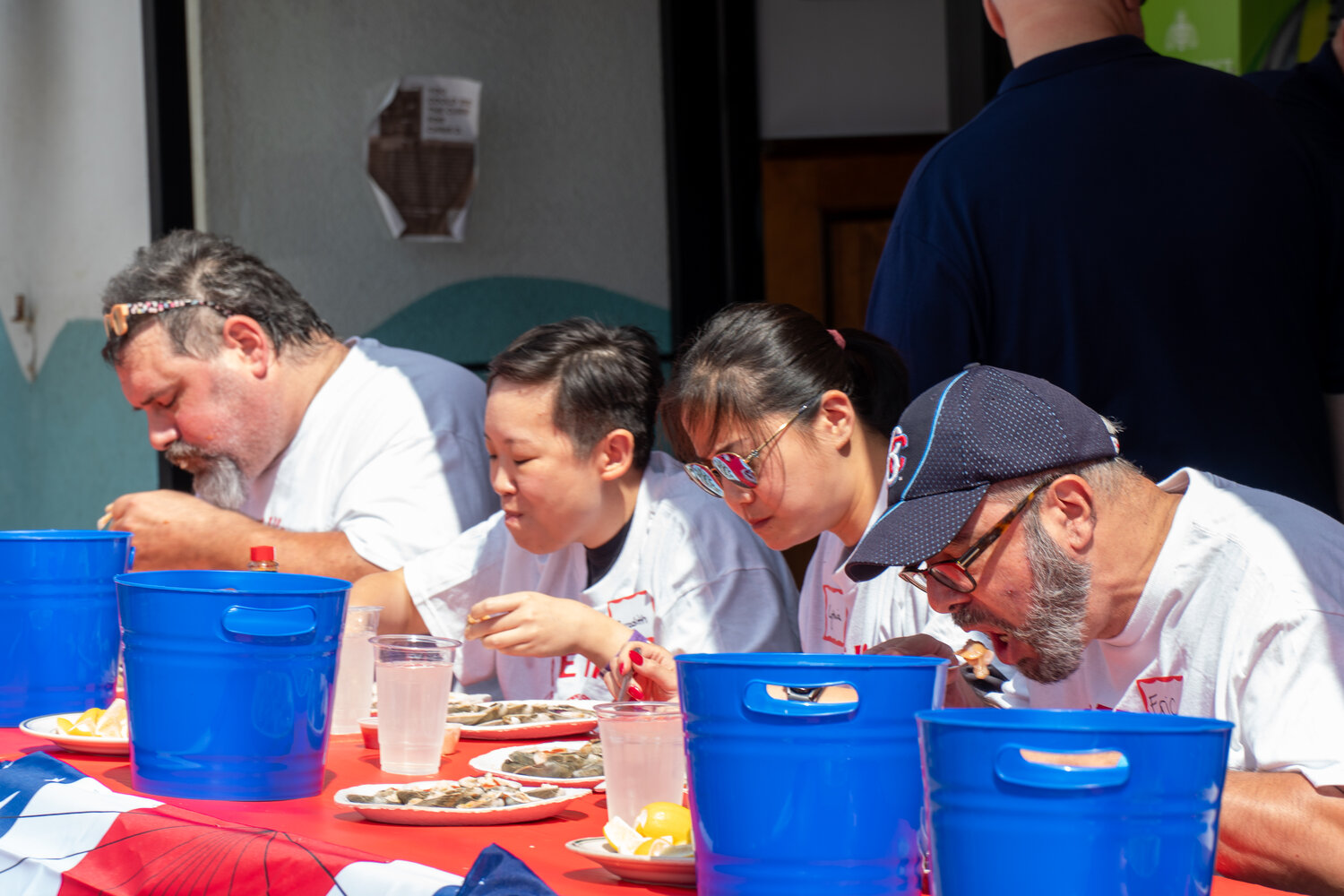 Merchetti, Meredith Wong, Cynthia Lam and Eric Schlittner were focused on clearing full plates.