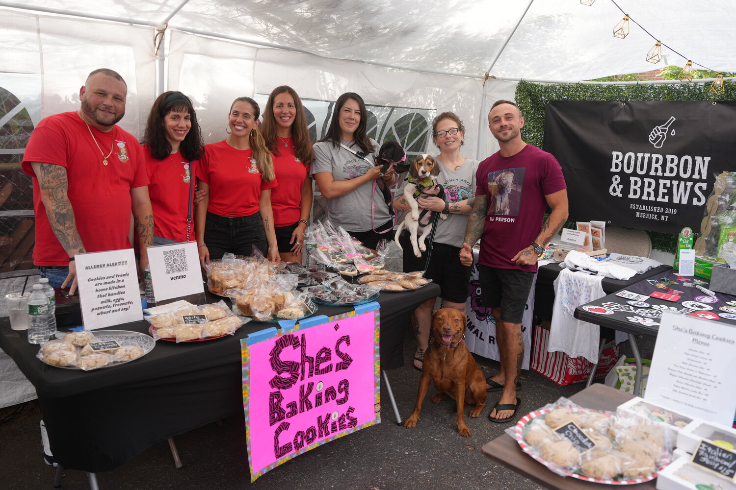 John Amaruso, owner of Bourbon & Brews, far right, with She’s Baking Cookies and volunteers from Heavenly Angels Animal Rescue.