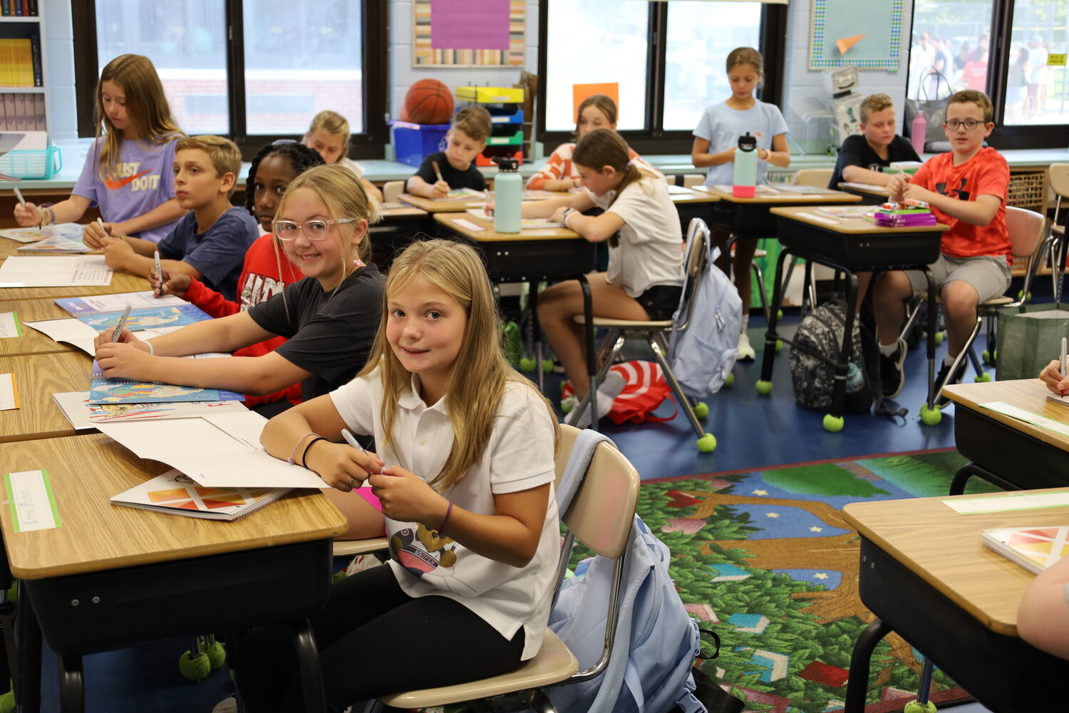 Students settle into their classroom for the first day of school at Floyd B. Watson Elementary.