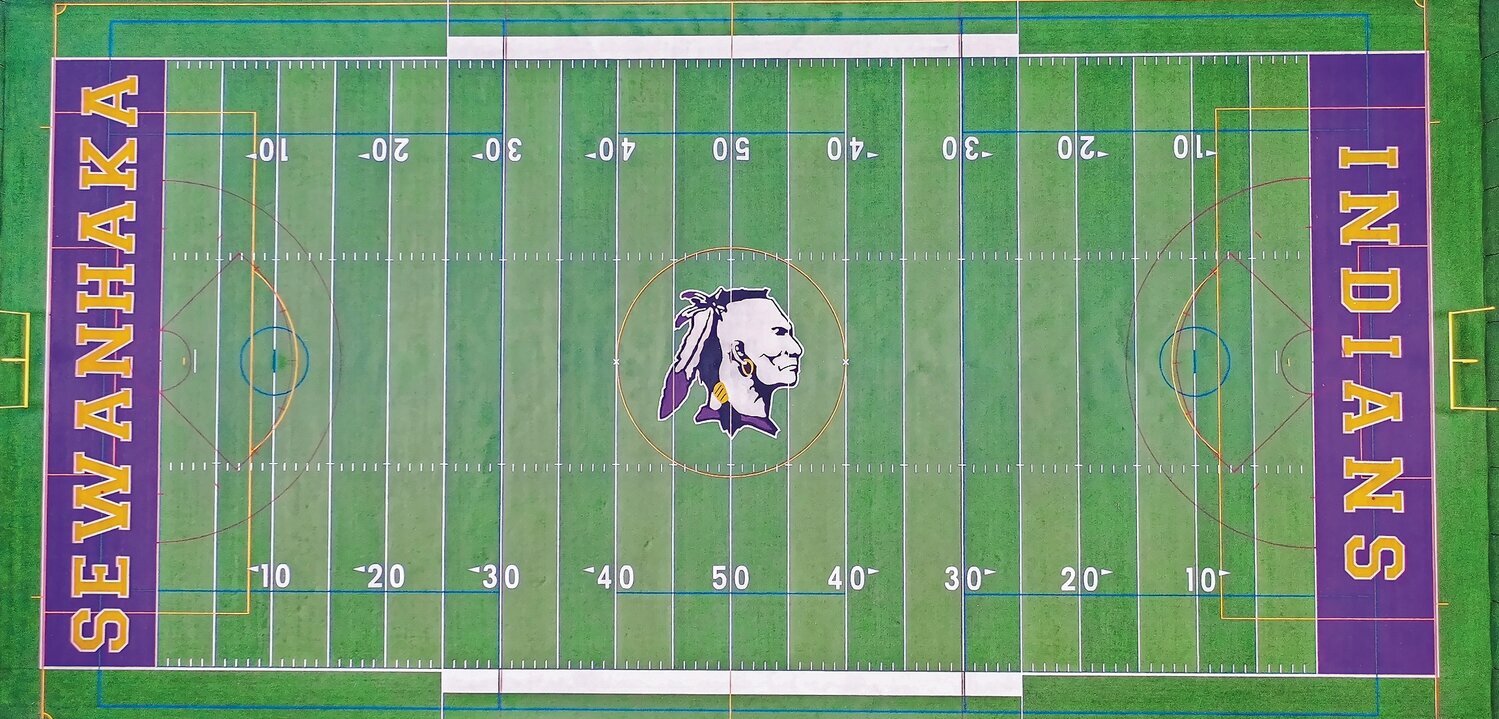 The Sewanhaka High School turf field reone in 2015, featured its longtime mascot whose depiction has become an increasingly offensive image to Native Americans. Recently, the board of education voted to hire the Josten’s company to create a new mascot for the school.