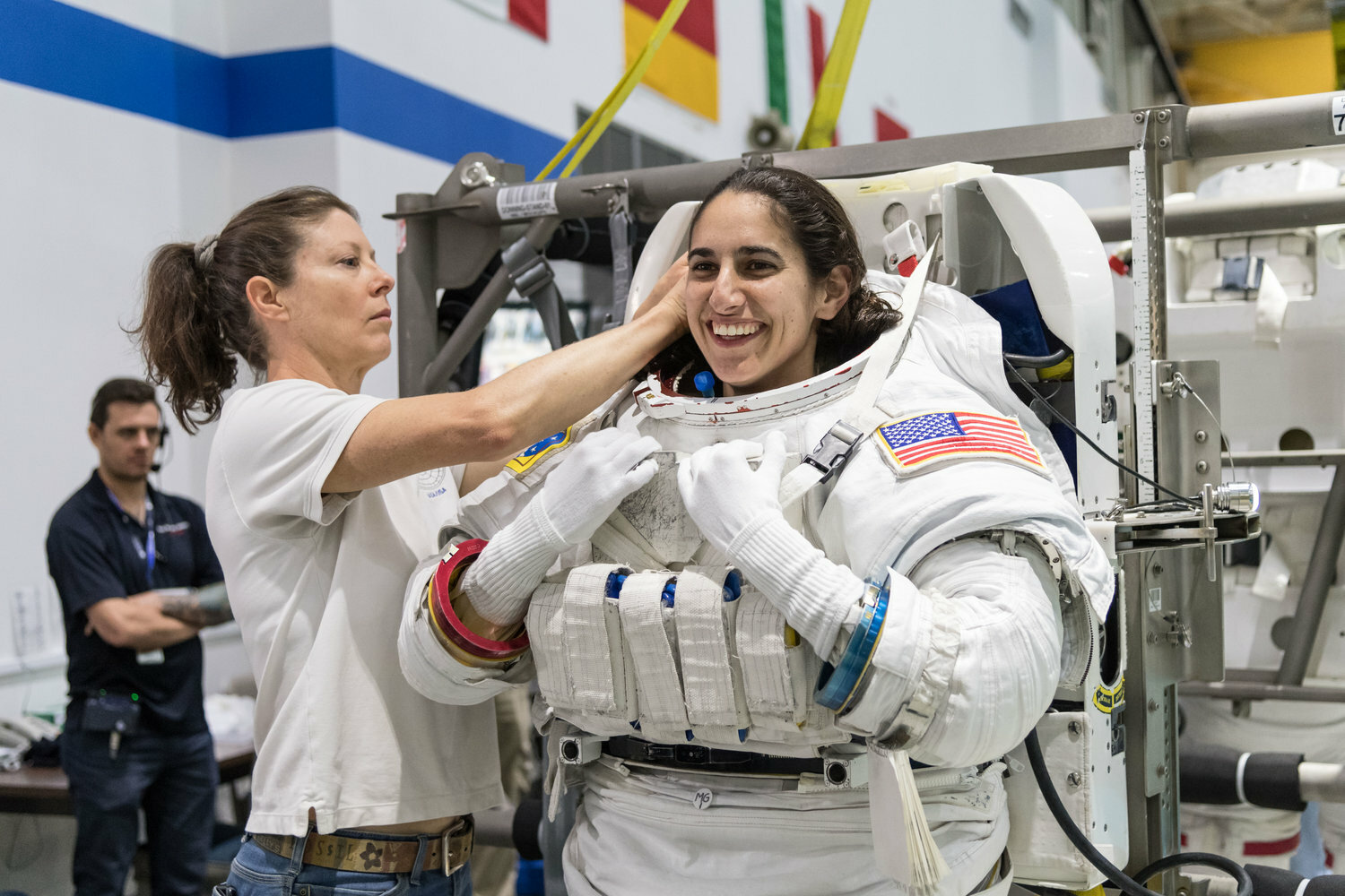 Jasmin Moghbeli was helped into a spacesuit before underwater spacewalk training at the Johnson Space Center’s Neutral Buoyancy Laboratory in Houston.