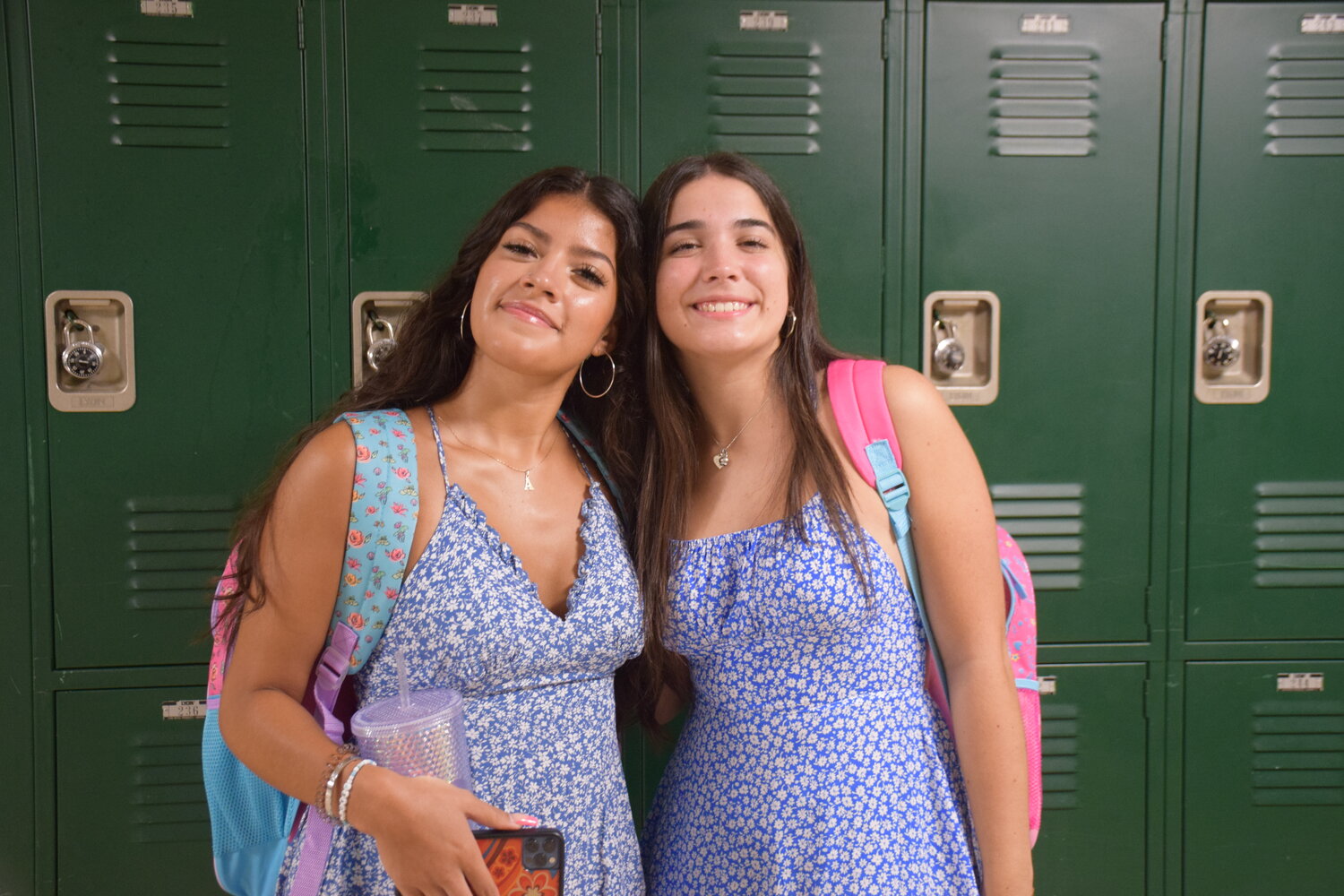 Locust Valley High School seniors Amanda Cerda, left, and Francesca LoCascio wore floral dresses for their first day back.