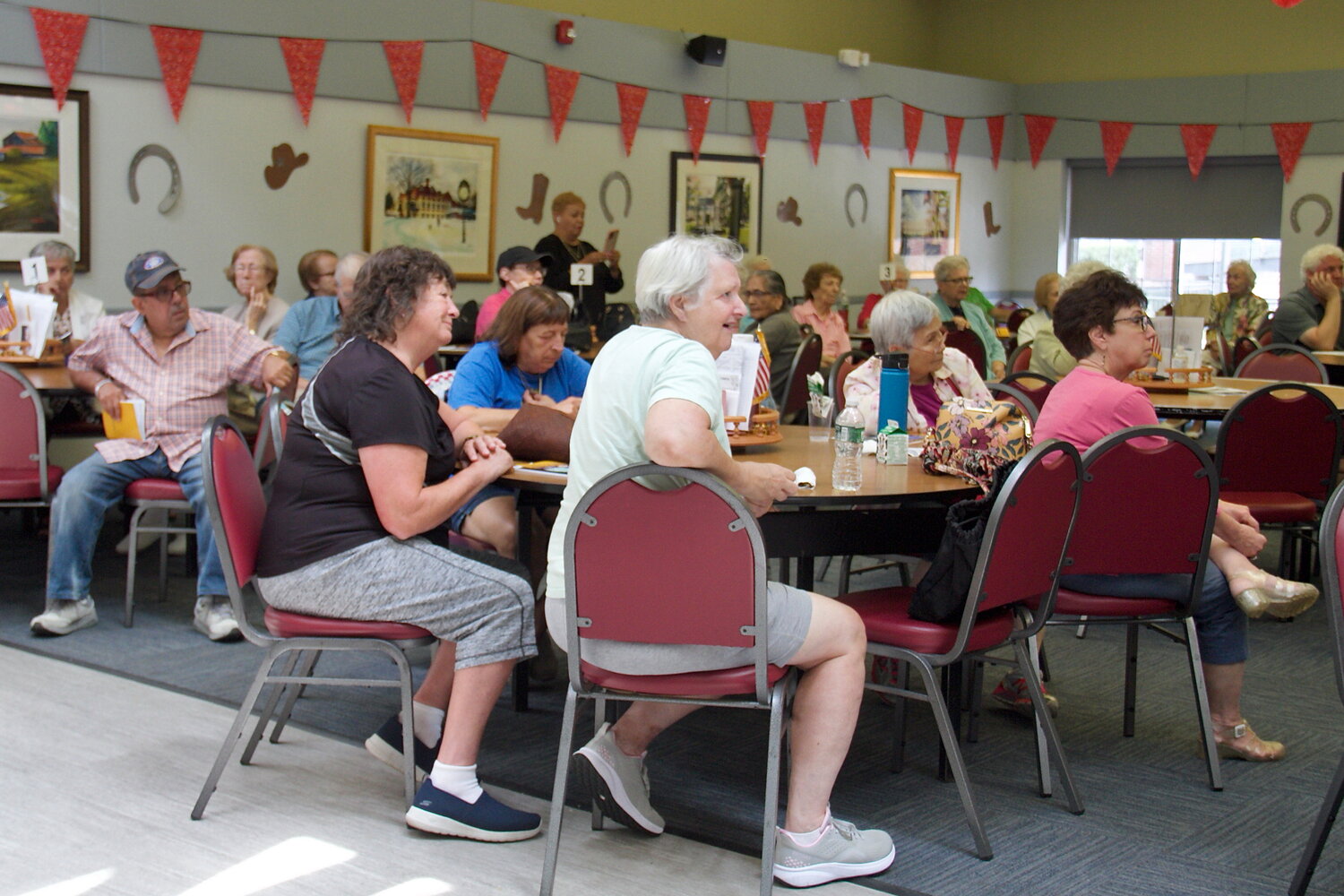 Seniors paid close attention on how to handle an emergency situation, including how to ration essential items like food and best use the emergency supplies provided.