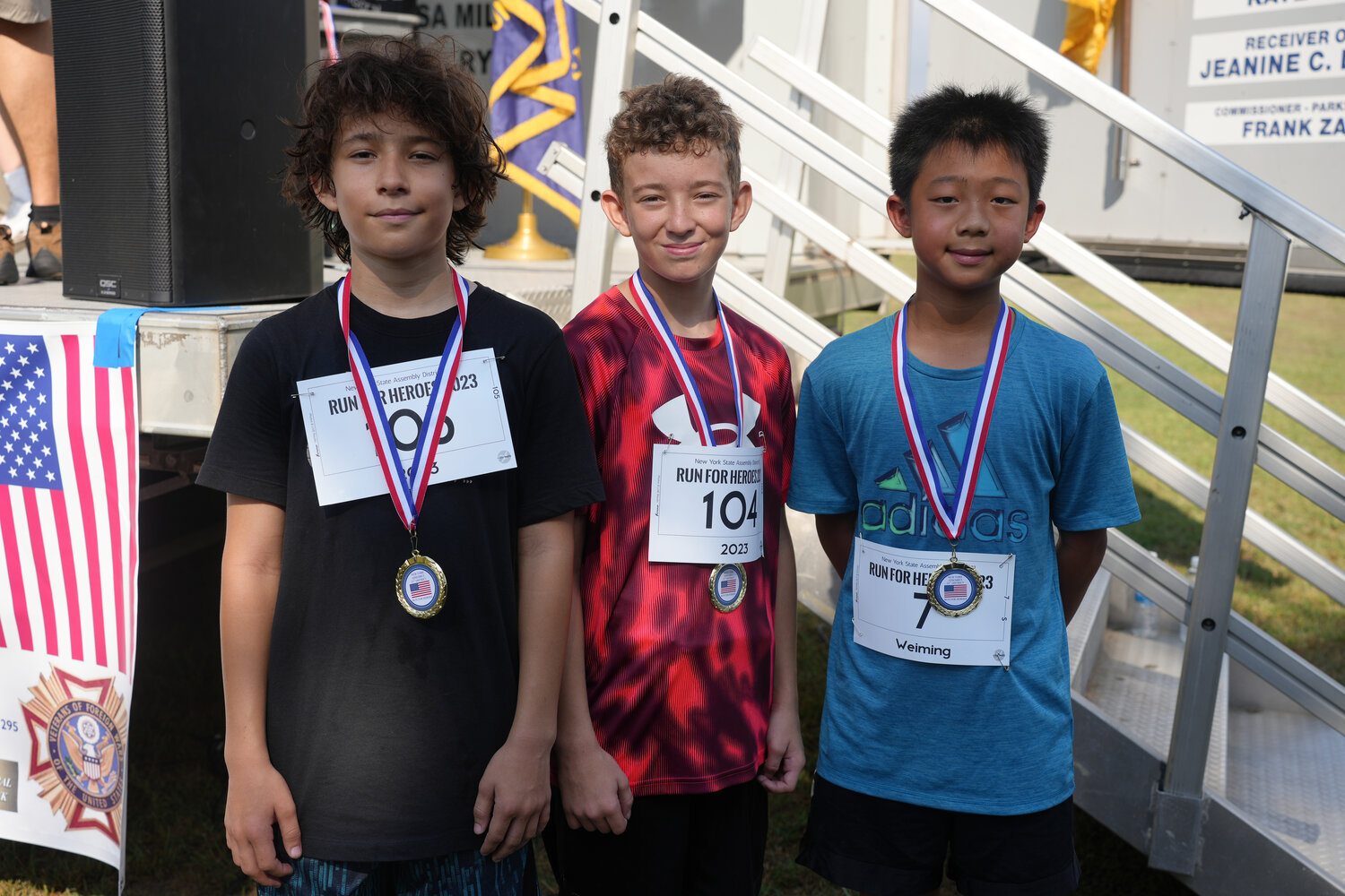 George Palomino from Rockville Centre, Fabian Palomino from Rockville Centre, and Lucas Zou from Williston Park participate in the 5k ‘Run for Heroes’ race.
