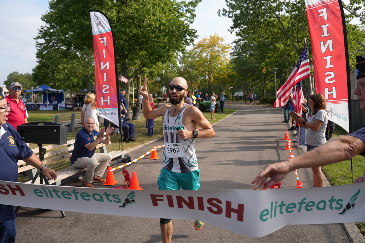 Keith Masso of Glen Cove finishes the 'Run for Heroes' 5k race as the first-place male winner.
