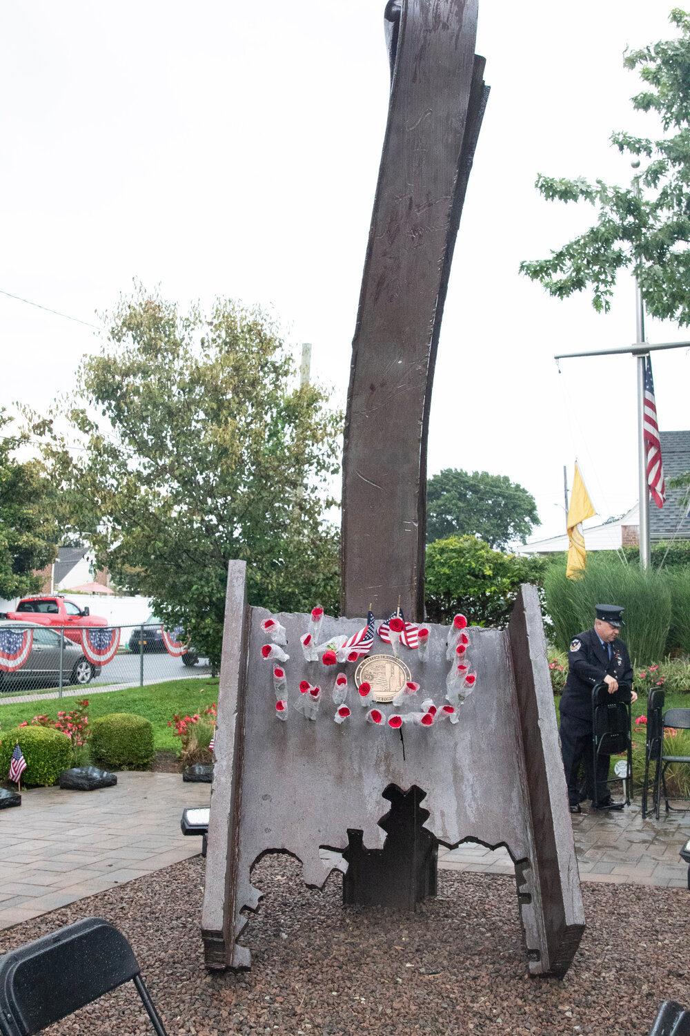 Roses were placed on the steel remnant from the World Trade Center at the Franklin Square 9/11 Memorial as the community remembered those who died.