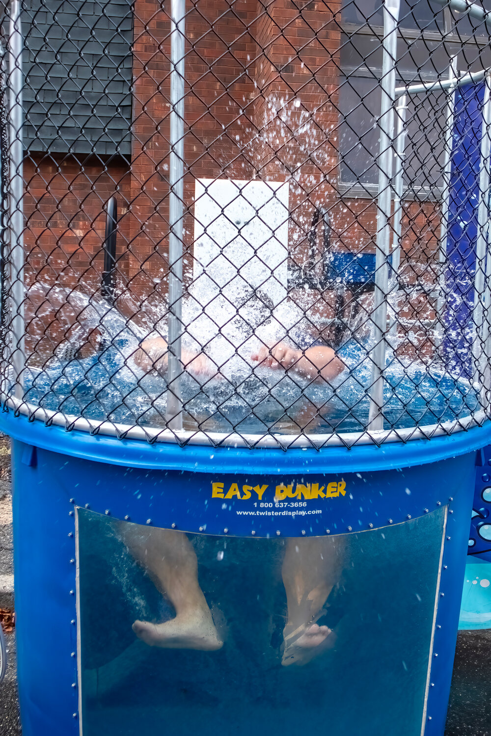 Splashdown! Tom Castagna got wet for fun in the Easy Dunker at the LWA barbecue.