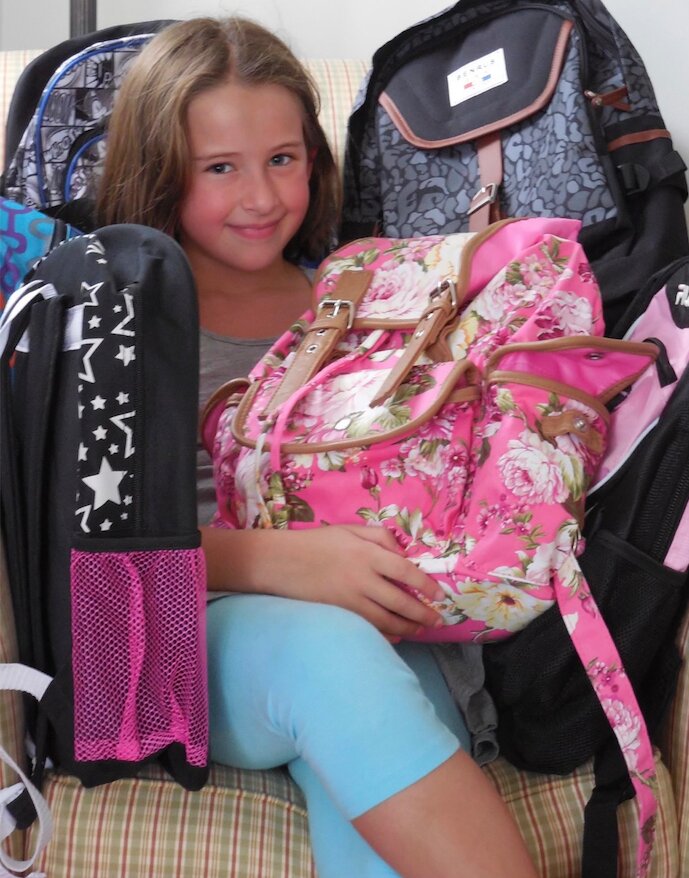 Abigail Ptacek began donating backpacks with her grandparents, who live near Martin Avenue Elementary School. In their first year of donating, they dropped off seven backpacks. This year they donated 54.