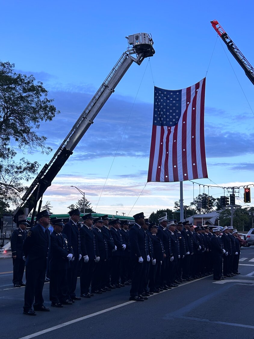 The Merrick Fire Department, joined with the North Merrick Fire Department, remembered and honored those who died during the Sept. 11 attacks. A massive American flag was hung along Sunrise Highway.