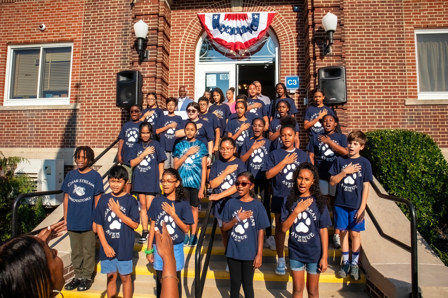 Clear Stream Avenue’s sixth-grade chorus sang the national anthem in kicking off the 100 Year Anniversary celebration.