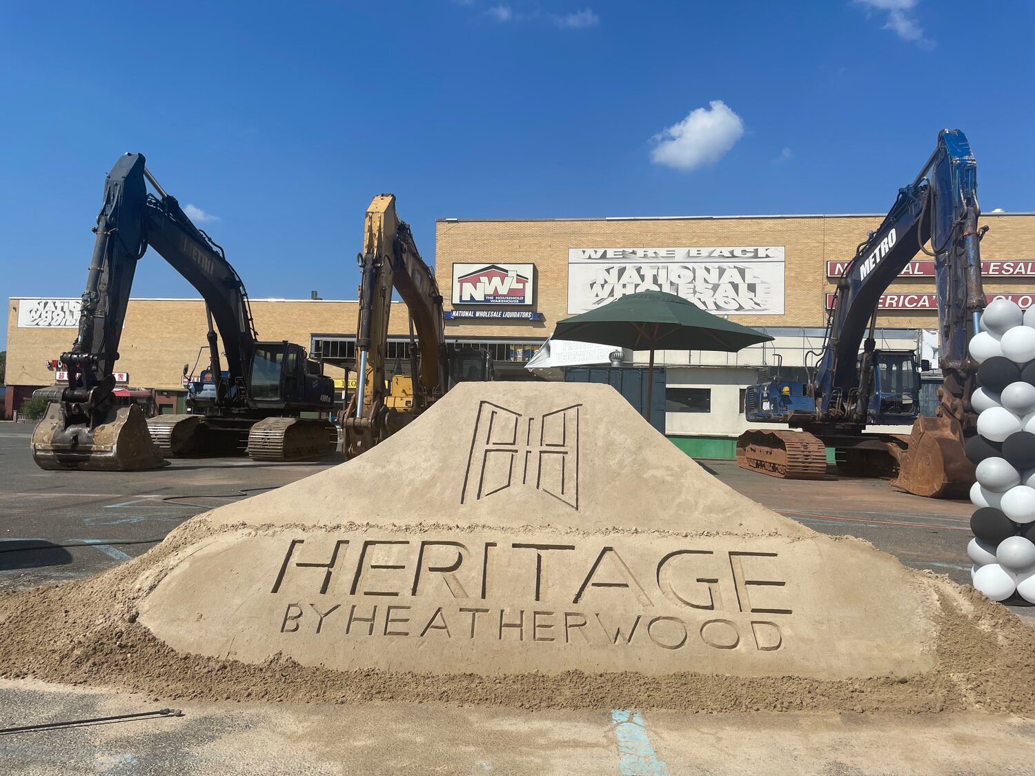 A sand sculpture commemorates the official groundbreaking of a project that Heatherwood, community representatives, and local politicians have worked together on for three years.