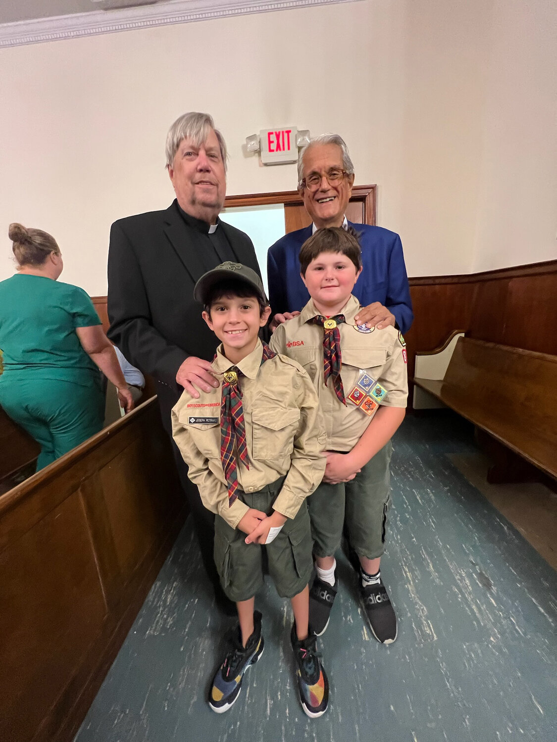 Father Chuck Romano (Left), Former town supervisor and trustee Anthony Santino (Right), Joseph Petraro (age 10, left), PJ Gaffney (Age 9, right)