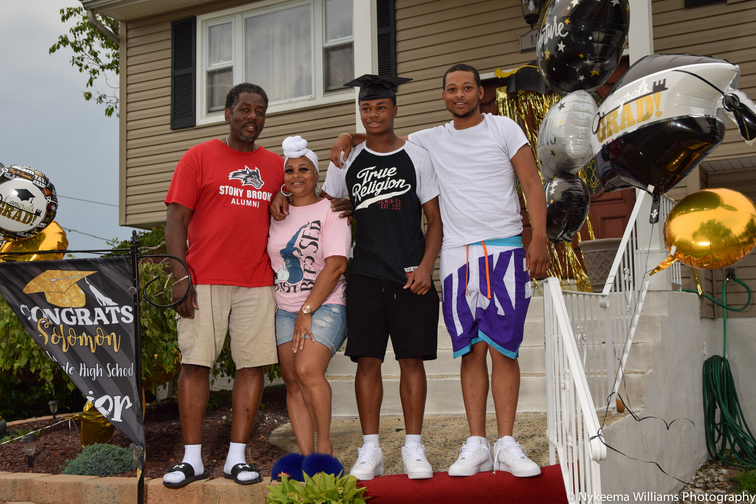 A new scholarship will honor Xavier Parris, who was killed in a car crash in Hempstead last October. Above, Parris, at the far right, with his mother, Empress Henderson, his brother, Solomon Henderson, and his father, Terrance Henderson.