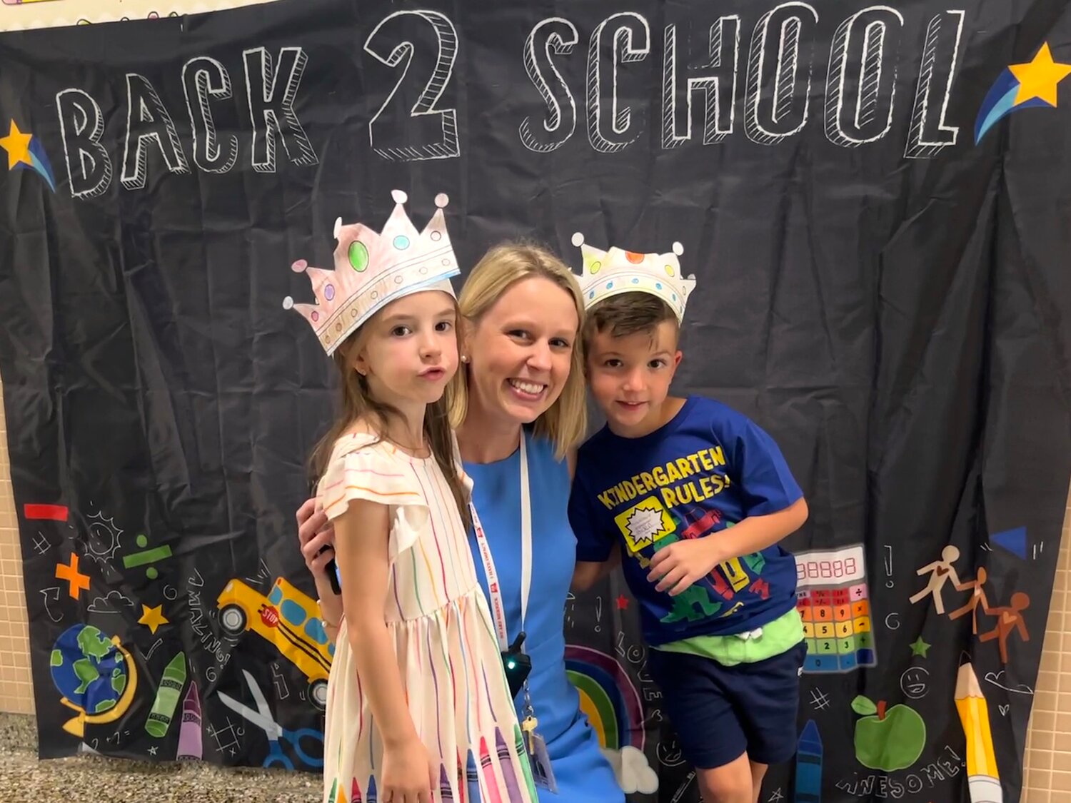 Meredith Kelly, assistant principal at Birch School, stopped to pose with students as they start their first day of school.