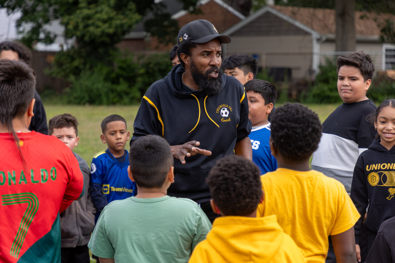 Coach Cohen Nelson, who has run the Uniondale Police Activity League for over 20 years and is also the long standing Uniondale High boys’ soccer coach, working with children at last Saturday’s event.