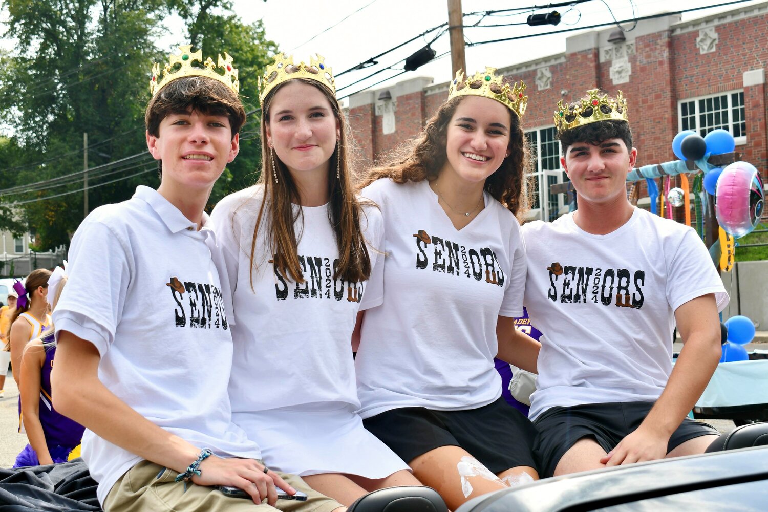 Oyster Bay High School seniors John Purcell, left, Ania Kelly, Kyra Sansone and Gianni Rizzuto were crowned homecoming royalty and participated in the homecoming parade.