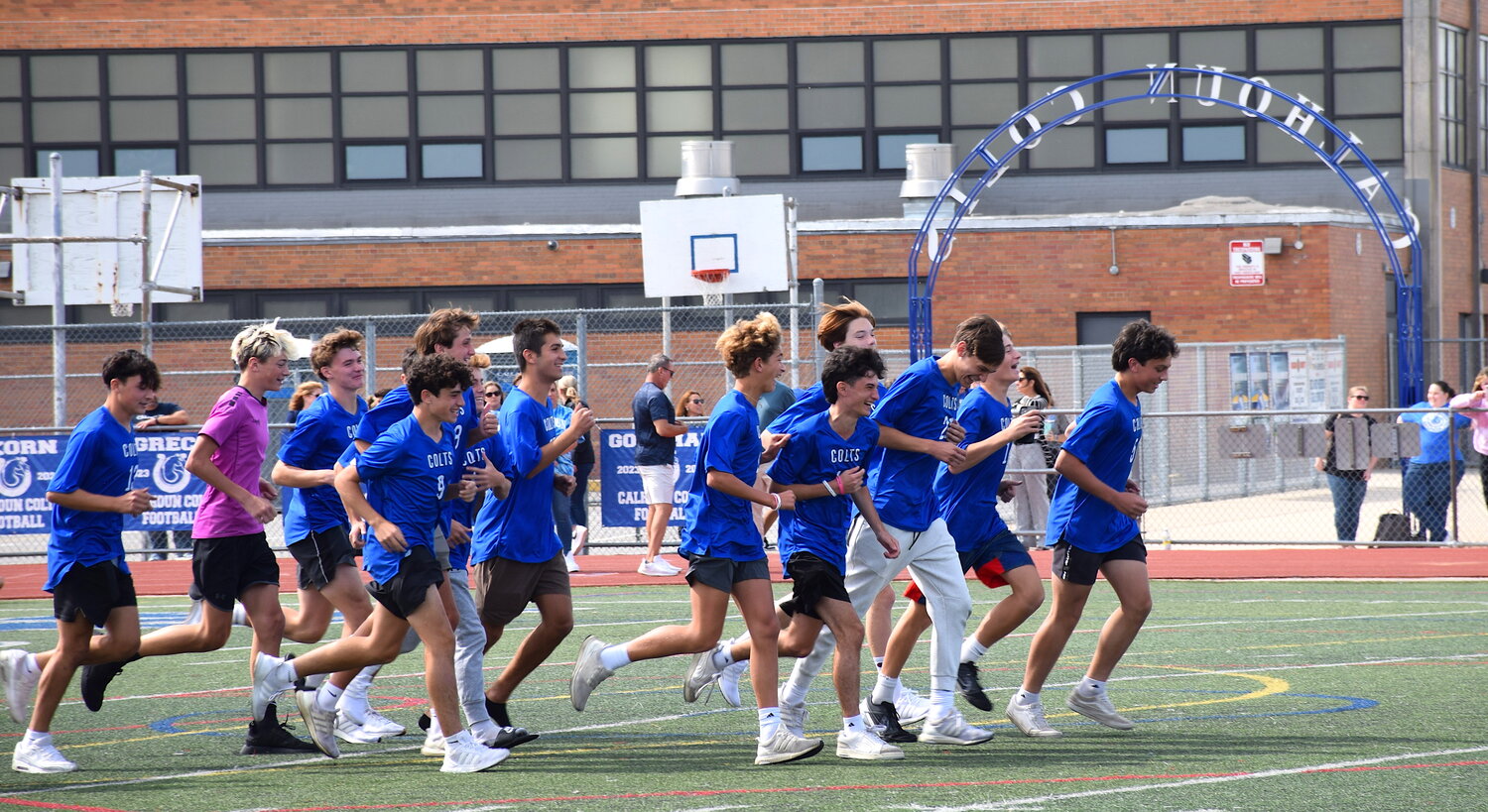 The boys soccer team charged onto the field  during the Sept. 22 pep rally.
