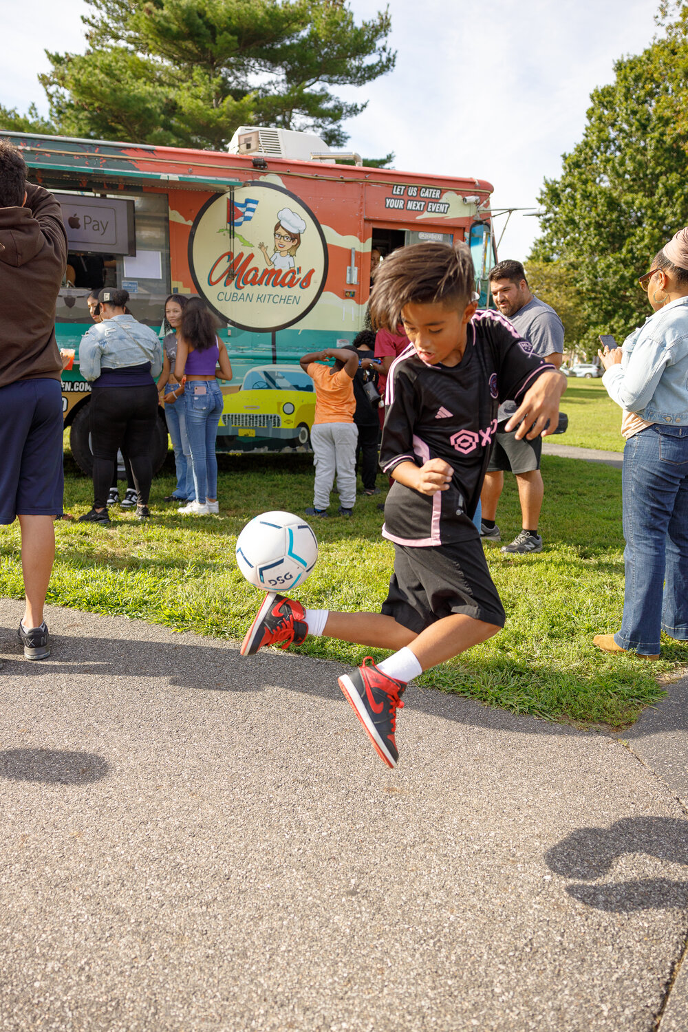 Izak Lozano, 9, enjoys soccer at the village’s Hispanic Heritage event.