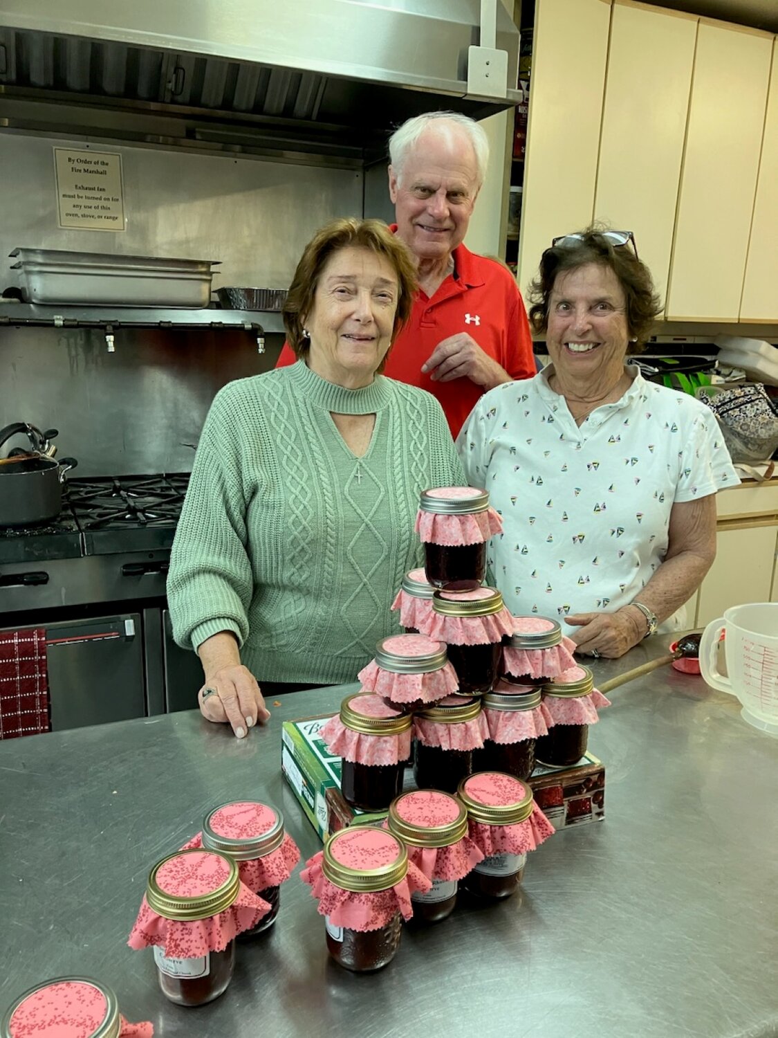 Over 30 different types of jellies will be available for purchase at the bazaar, thanks to the efforts of volunteers like Janette Heurtley, left, Nigel Hawkins and Lainry Ganzenmuller, who have spent the last seven months making them.