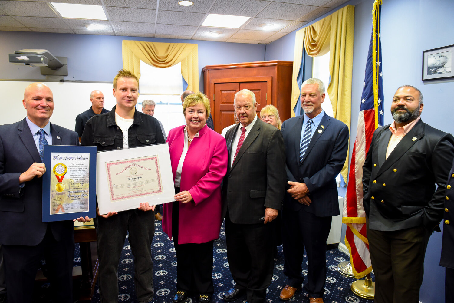 Ukrainian refugee Volodymyr Zubko was honored Oct. 12 in Village Hall for rescuing a driver whose car plunged into a narrow waterway just east of the Nautical Mile