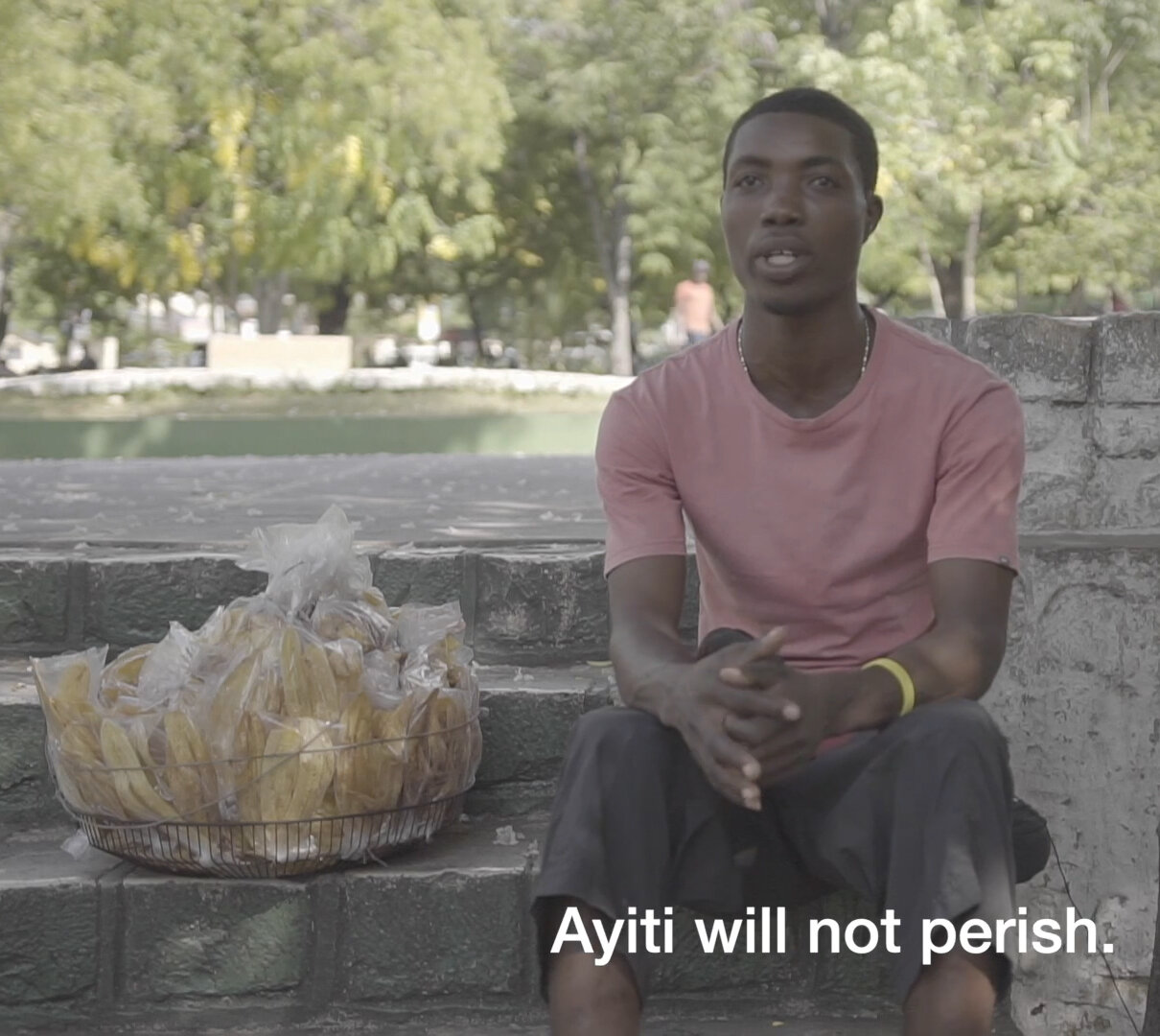 Charlot Lherisson, 25, who sells packaged fruit from 5 a.m. to 6 p.m., believes that Haiti will not perish because it still can change.