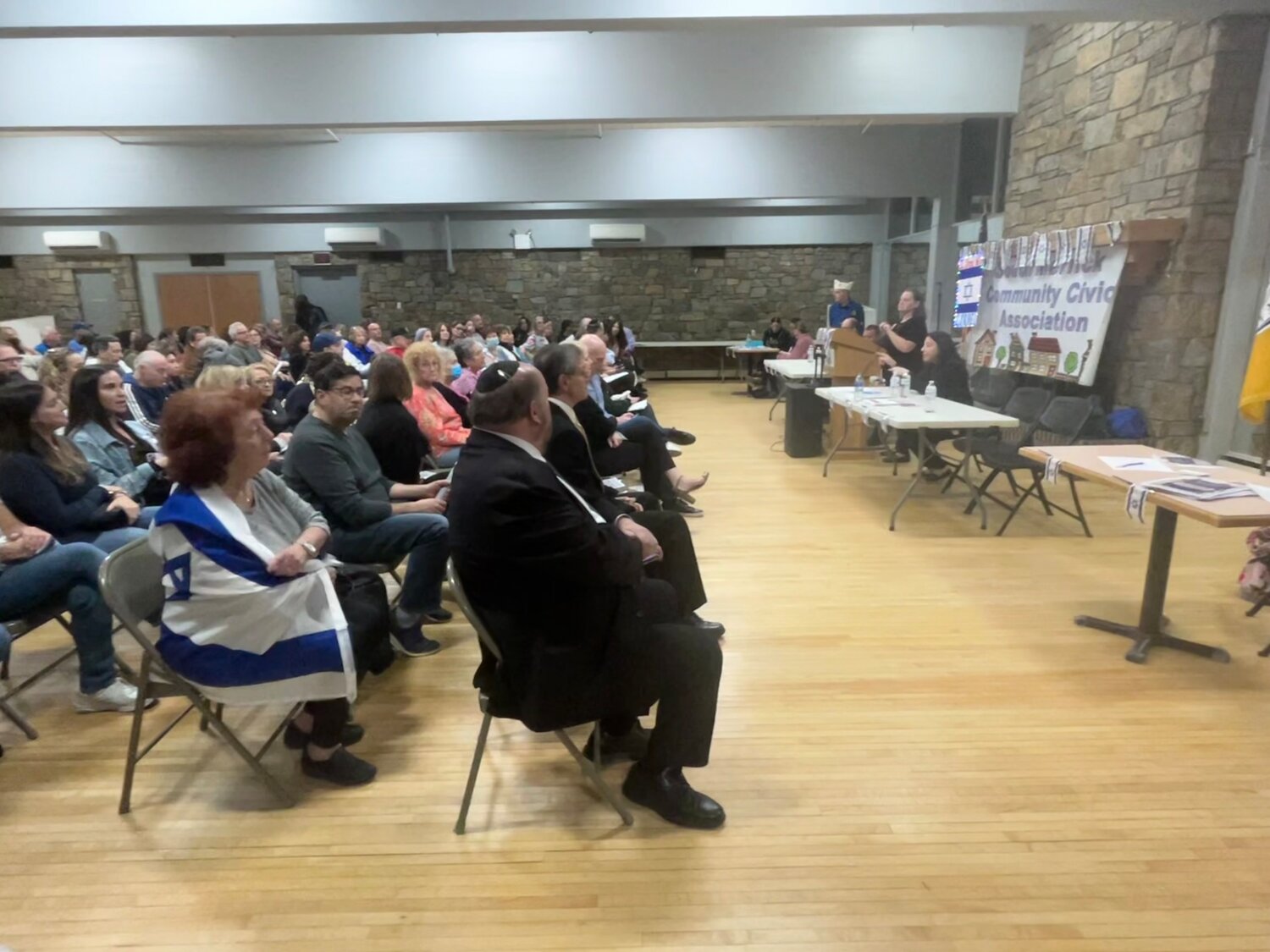 Members of the community, the clergy and the Nassau County Police Department’s 7th Precinct gathered on Oct. 19 at a meeting in Merrick, to show their support for Israel.