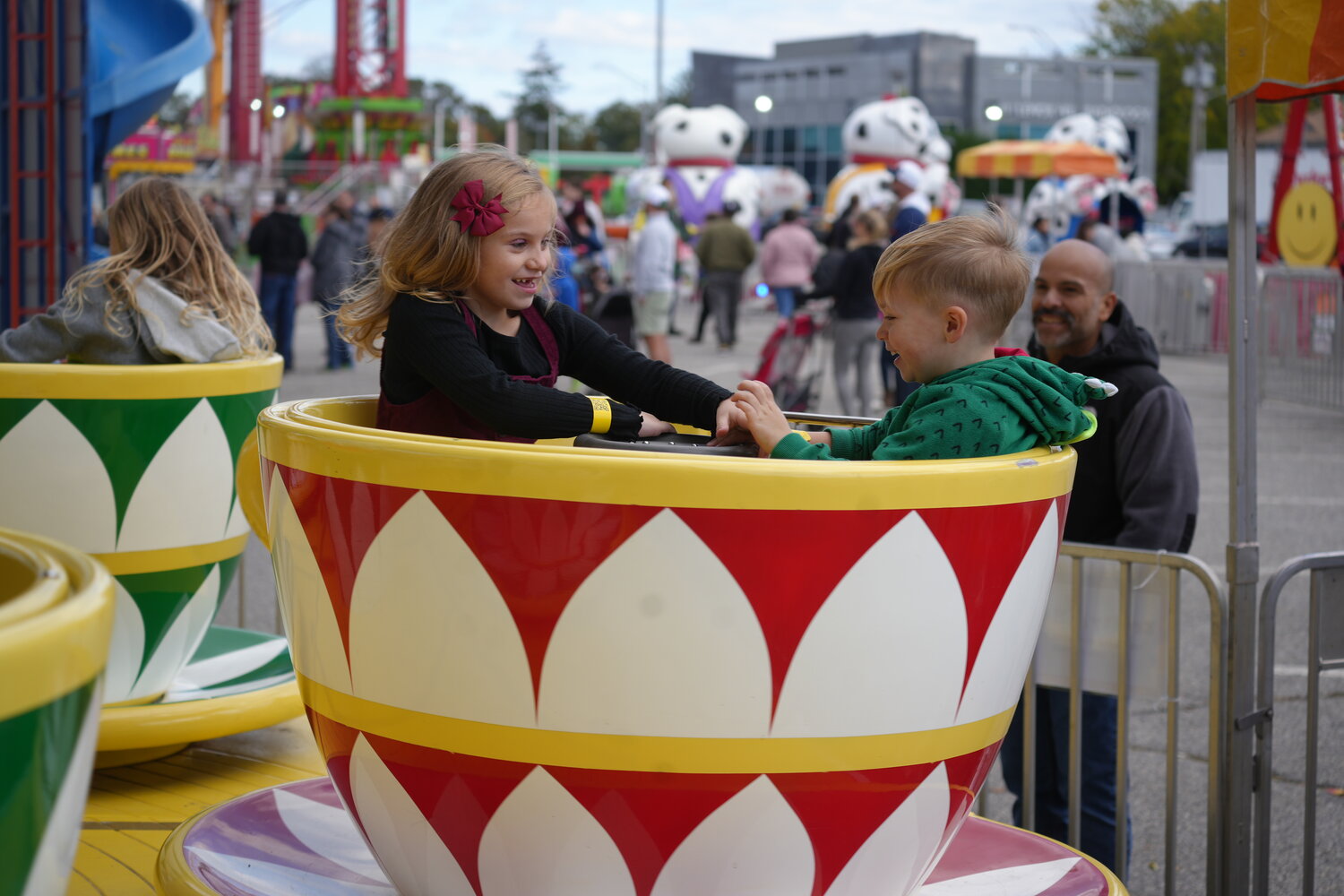 Over at the carnival, Grace Hughes and Brian Hughes, 6 and 3, had a blast riding the teacups.