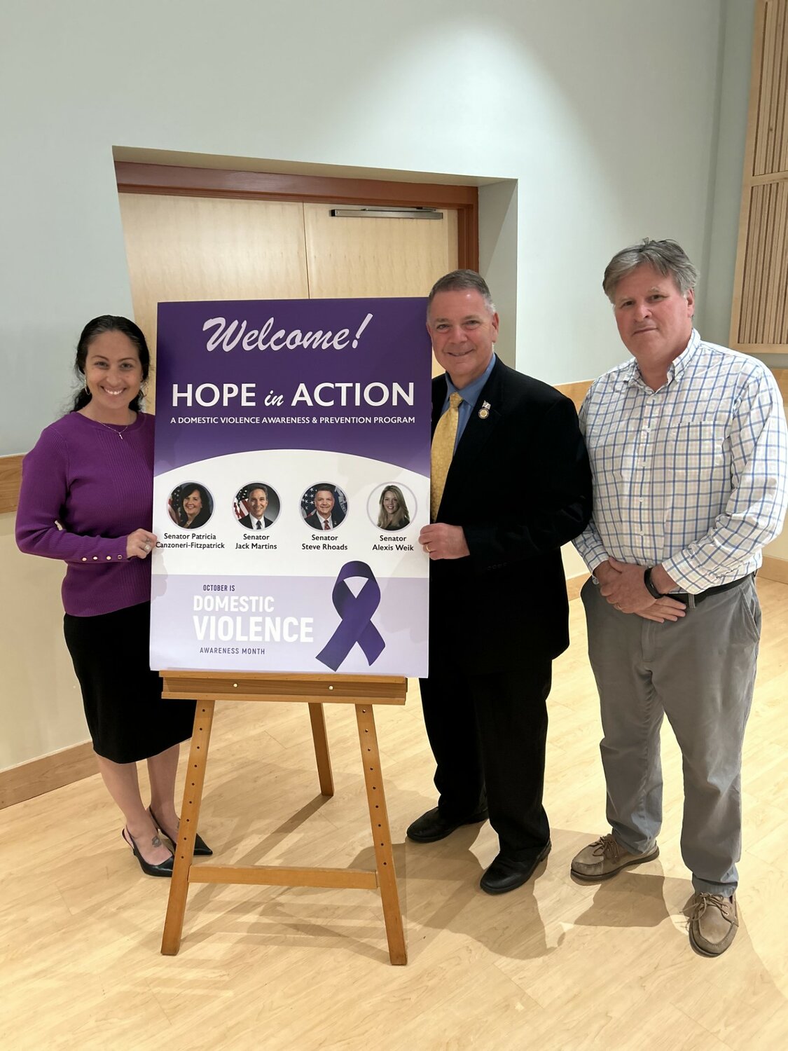 State Sen. Steve Rhoads, center, brought a panel focusing on domestic violence awareness, to the East Meadow library, with partners in government. Rhoads, with Jennifer Rowland, of The Safe Center LI and Paul Ehrlich, State Sen. Jack Martins’ chief of staff.