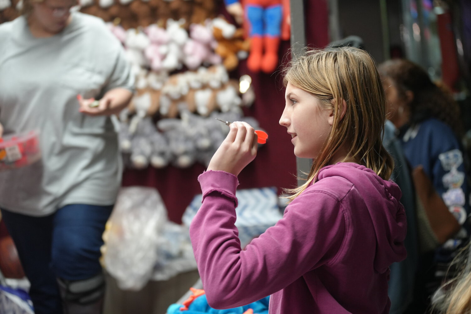 McKenzie Bender, 12, of South Hempstead, played a round of darts at the East Meadow Chamber’s carnival.