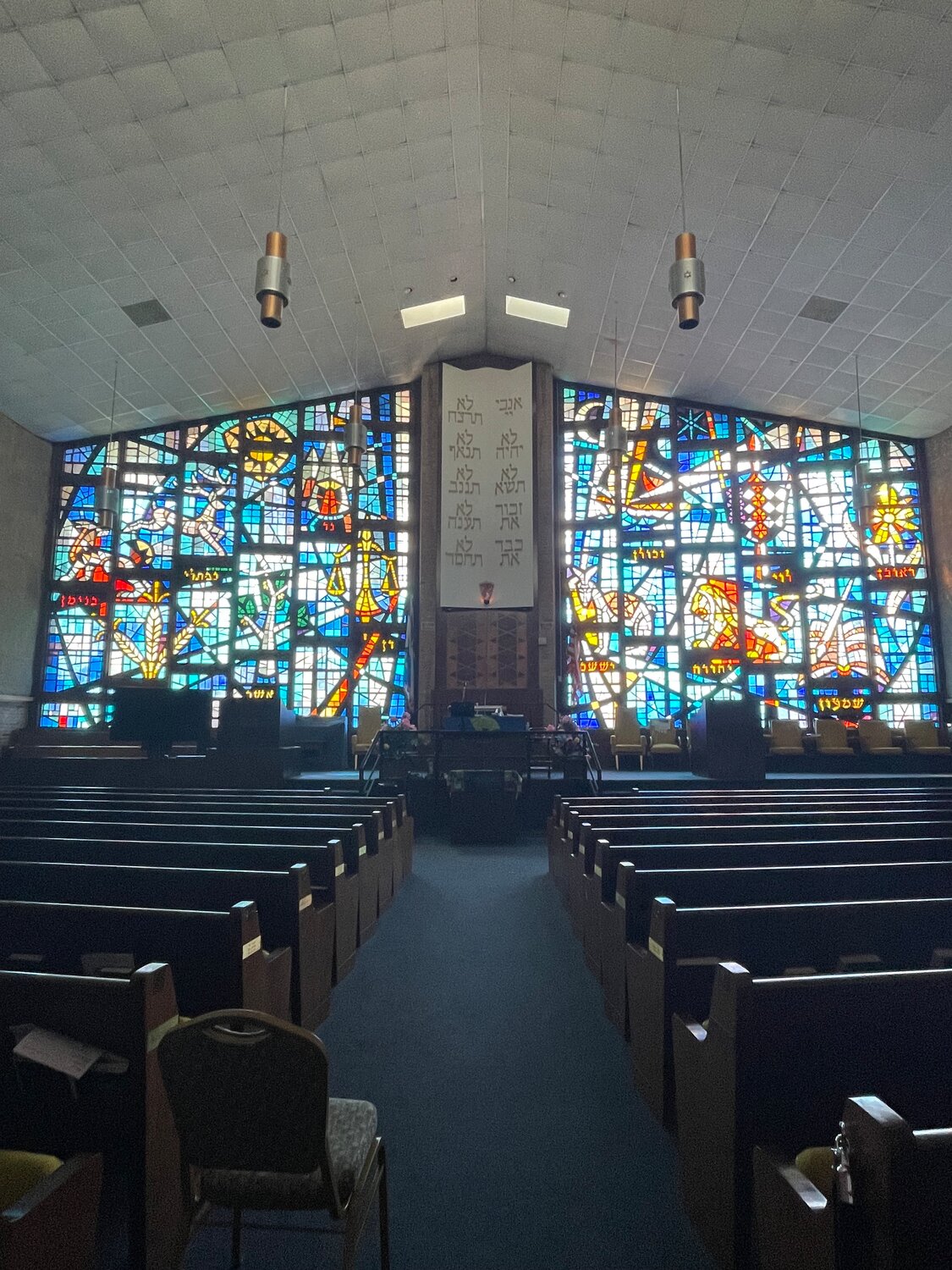 Sunlight shines through 3,000 stained glass pieces at Shaaray Shalom in West Hempstead. The congregation has seen an increased police presence since Nassau County Executive Bruce Blakeman committed law enforcement resources to Jewish safety.