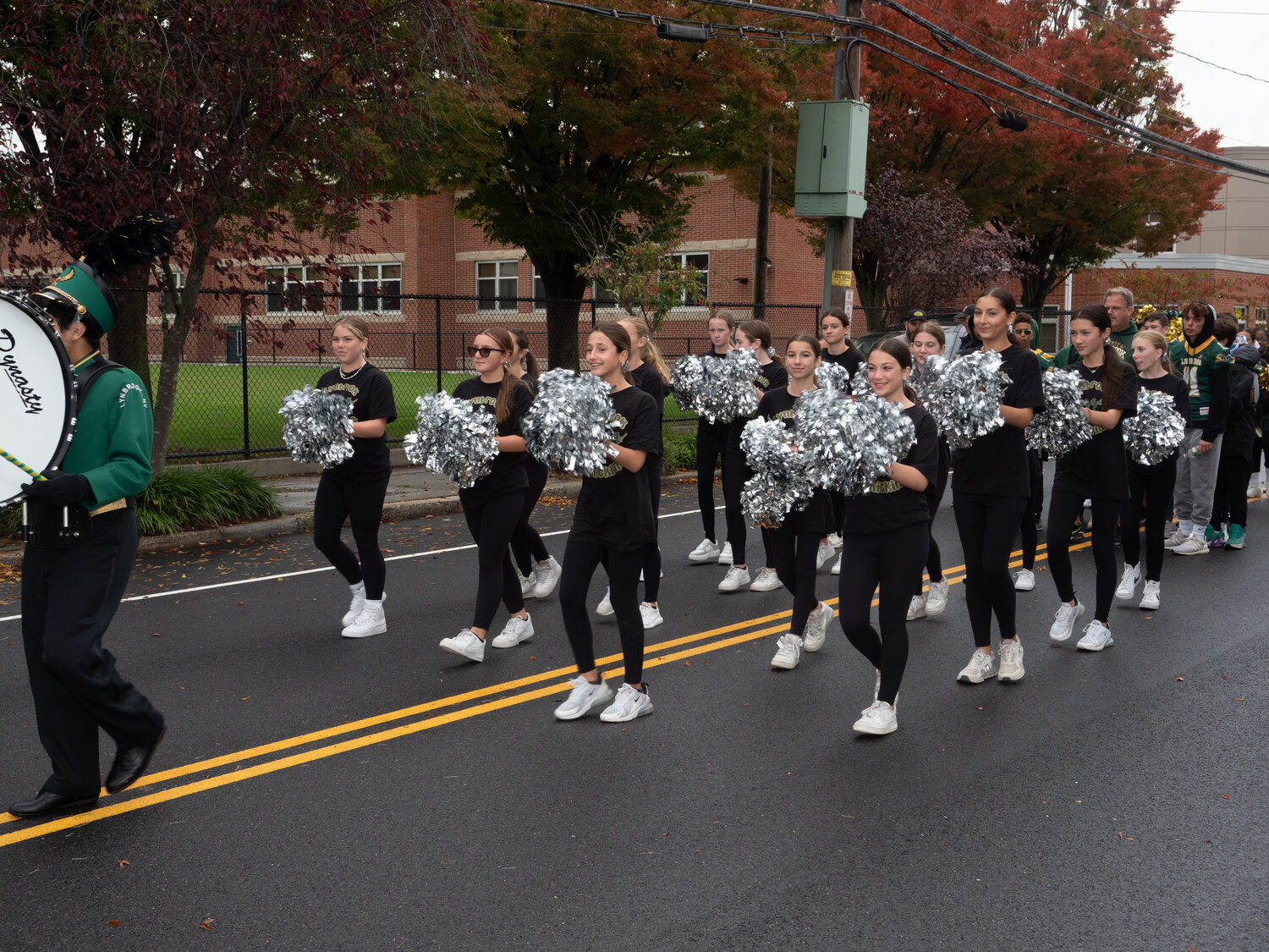 The kickline team added enthusiasm during the parade.