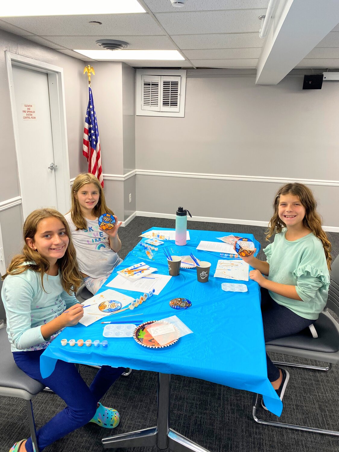 From left, 10-year-olds A.J. Maresca, Sydney Kelly and Charlotte Hamel finish painting their suncatchers.