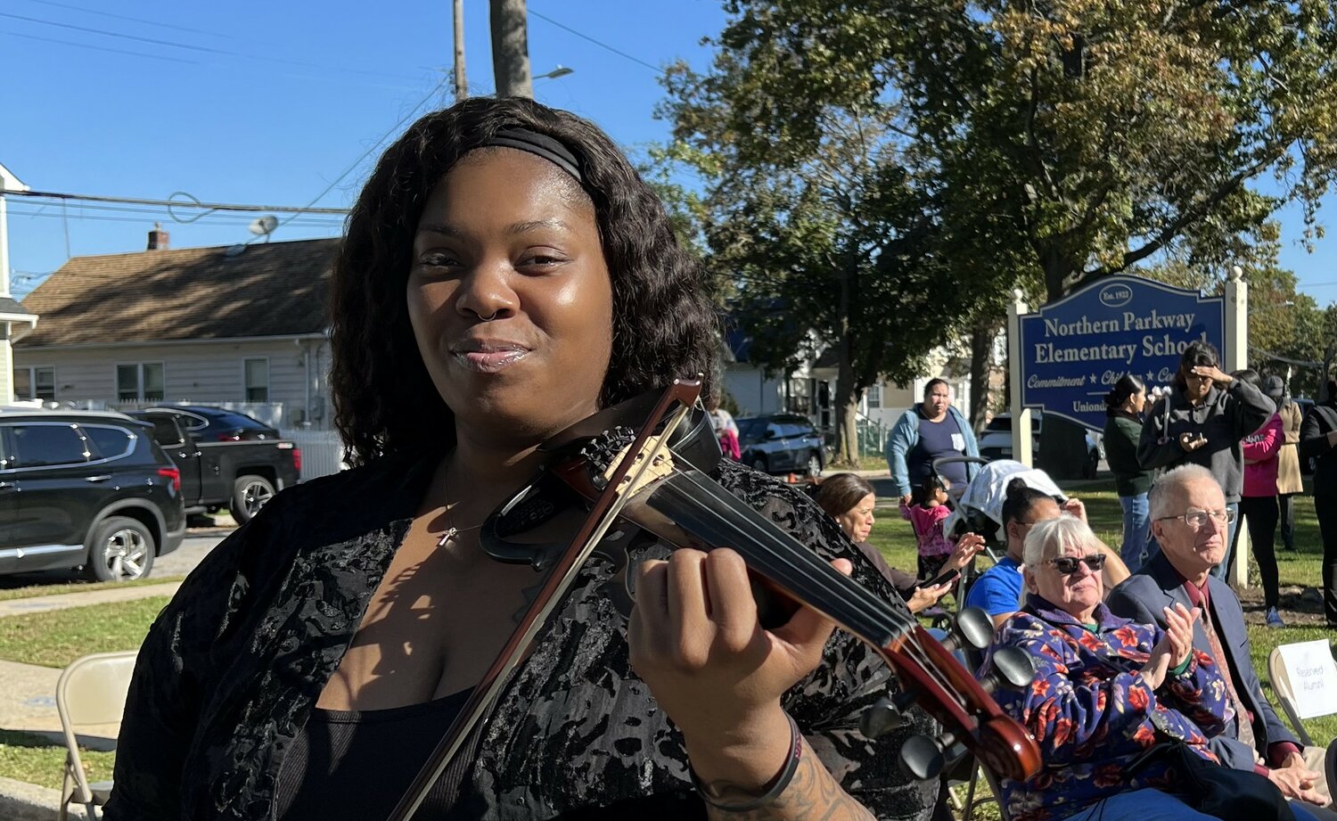 Northern Parkway School alumnus Adebisi Labinjo, whose professional name is Classique, sent sweet, wild tones from her violin out to the crowd at the school’s 100th anniversary celebration.