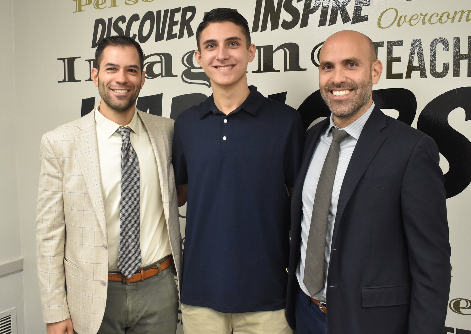 James Tullo was congratulated for his achievement by Principal Paul Guzzone, left, and Assistant Principal Nick Pappas.