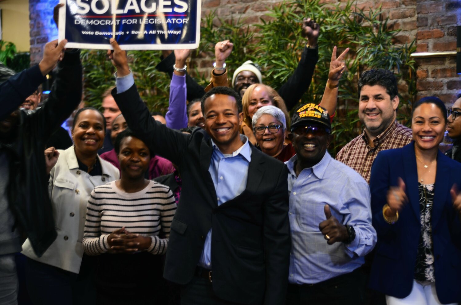 County Legislator Carrié Solages declared victory at a celebratory gathering at Le Spot Café in Elmont as unofficial results from the Nassau County Board of Elections showed him leading with 62 percent of the vote as of midnight Wednesday.