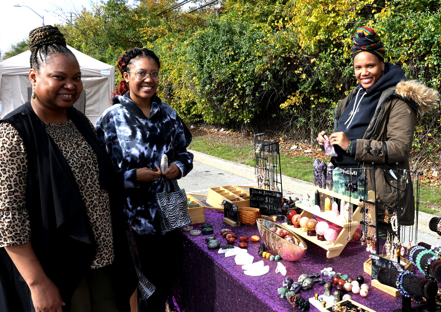 Cecilia Carter with her daughter Ateah Carter purchasing a few crystals and handmade jewelry pieces from Jewel Scott, business owner of Johari’s Shoppe.