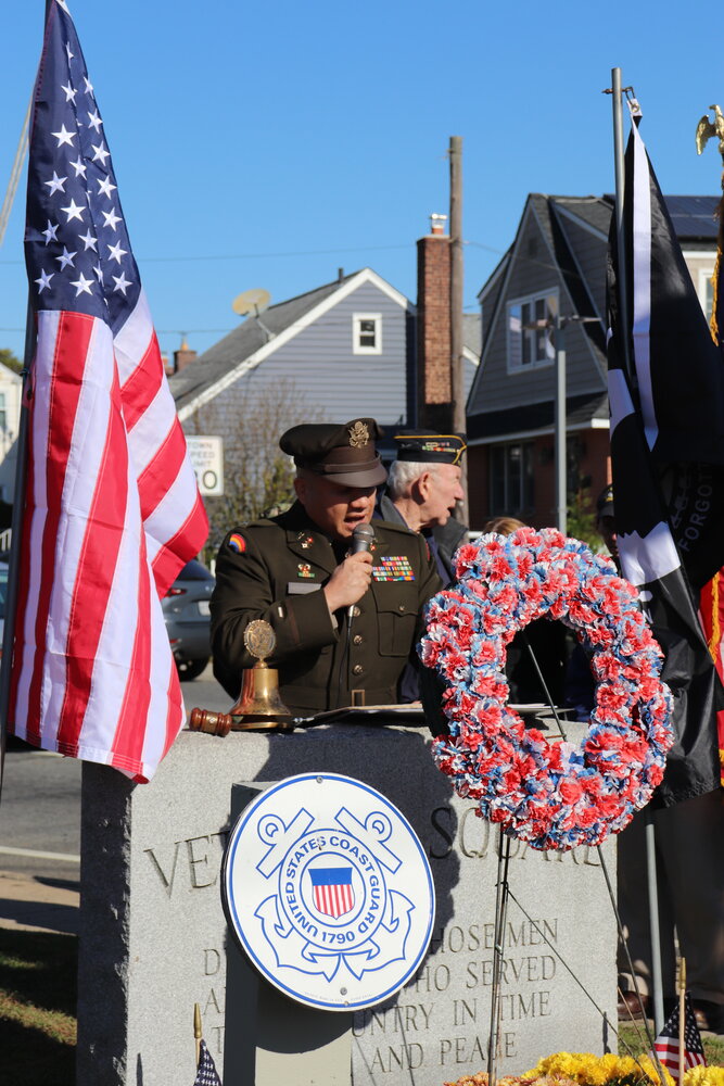 Manuel Rodriguez, army chief warrant officer 2, addressed the crowd during the ceremony at Veterans Square in Elmont last Saturday.