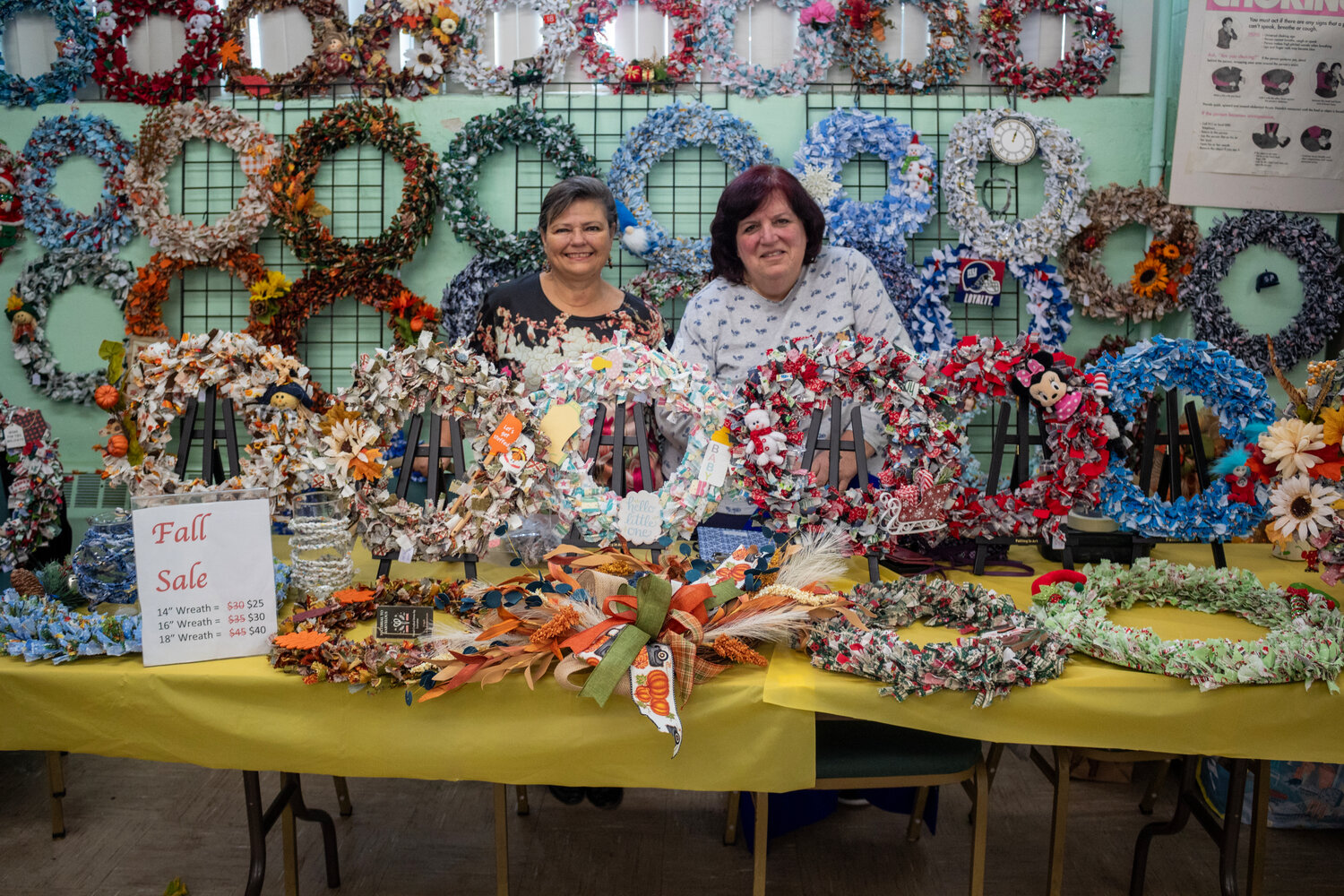 Marian Over and Lorraine Corvino stood behind a beautifully set up wreath booth during the country fair on Nov. 4.