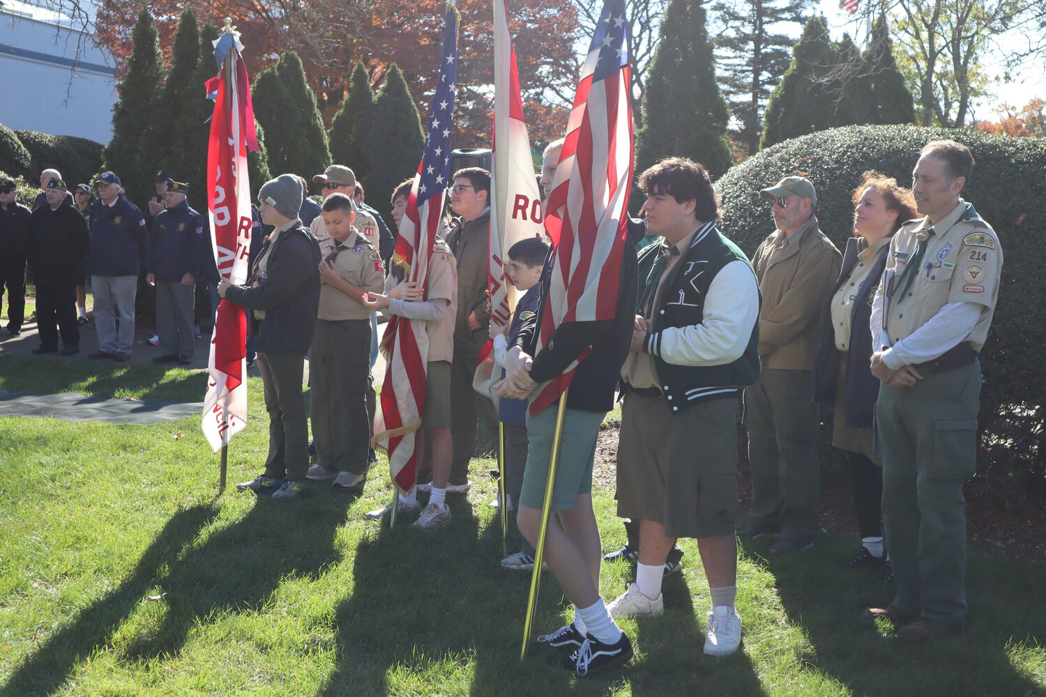Members of Boy Scout Troops 40 and 214 honoring local veterans in the ceremony at the Recreation Center last Saturday.