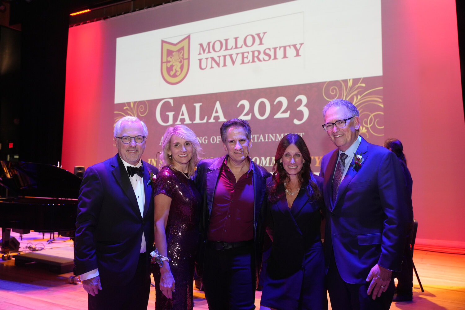 Molloy University President James Lentini, left, is joined by his wife, Dana Lentini, Seth Rudetsky of SiriusXM, and Gala co-chairs Susan Santoro and Wayne Lipton as they celebrate an evening of entertainment at the Madison Theatre.