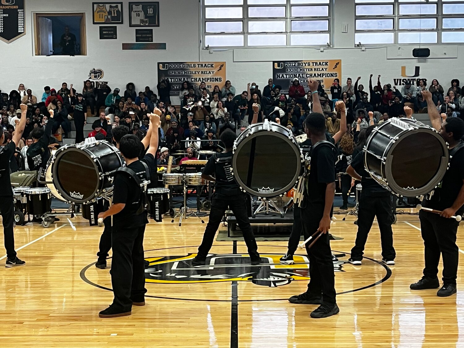 Members of Brentwood’s marching band, the Green Machine, at the end of their performance at Uniondale’s second annual Percussion Night.
